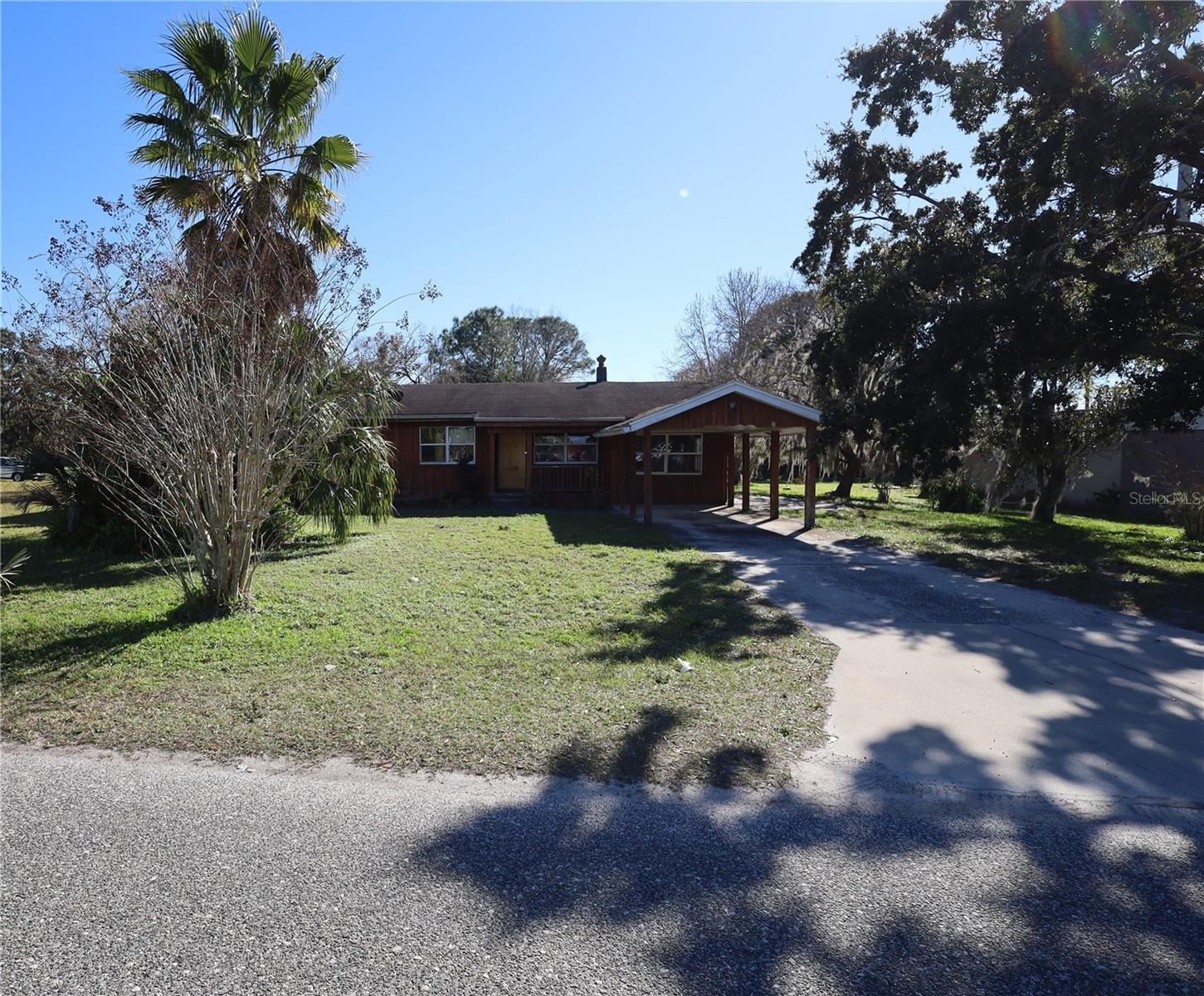 This 3-bedroom, 2-bathroom gem is nestled on a spacious lot, surrounded by natural charm. The 1-car carport and cozy fireplace add to the allure of this property. Embrace the potential of this home, an ideal canvas for someone looking to create something extraordinary. Minutes to Historic downtown Sanford, public and private boat ramps at local St. Johns River areas, Sanford airport, and major roads such as SR 46, SR 95, 415, 417, and I4. Seize the chance to shape this property into your dream oasis. With 3 bedrooms and 2 bathrooms, as well as a larger lot, this home provides ample space for outdoor endeavors. Don't miss out on this opportunity to turn potential into reality!