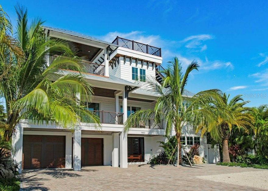 This stunning 9-bedroom, 8.5-bathroom beachfront property offers 3,983 sq ft of heated interior space and comes FULLY FURNISHED with luxurious details throughout. The home boasts an open-concept layout with vibrant living areas, a well-appointed chef’s kitchen, and multiple decks for enjoying ocean views. This home completed in 2020, has a custom private pool with a lazy river-inspired style, a putting green, and a rooftop deck offering 360 water views. Each of the 7 king-sized bedrooms features chic designs, ensuite baths, with many including private balconies. The primary suite includes a large tub, step-in shower, and a private ocean-view balcony. Additional amenities include a convenient elevator, laundry room, and a bar area with a wine fridge. The property’s modern coastal elegance blends perfectly with functional design, creating a space ideal for everyday living or hosting guests- GREAT RENTAL OPPORTUNITY. Located on Anna Maria Island, this home offers beach access and endless opportunities to enjoy the sun and sand. Experience the ultimate blend of luxury and comfort in this meticulously designed coastal haven.