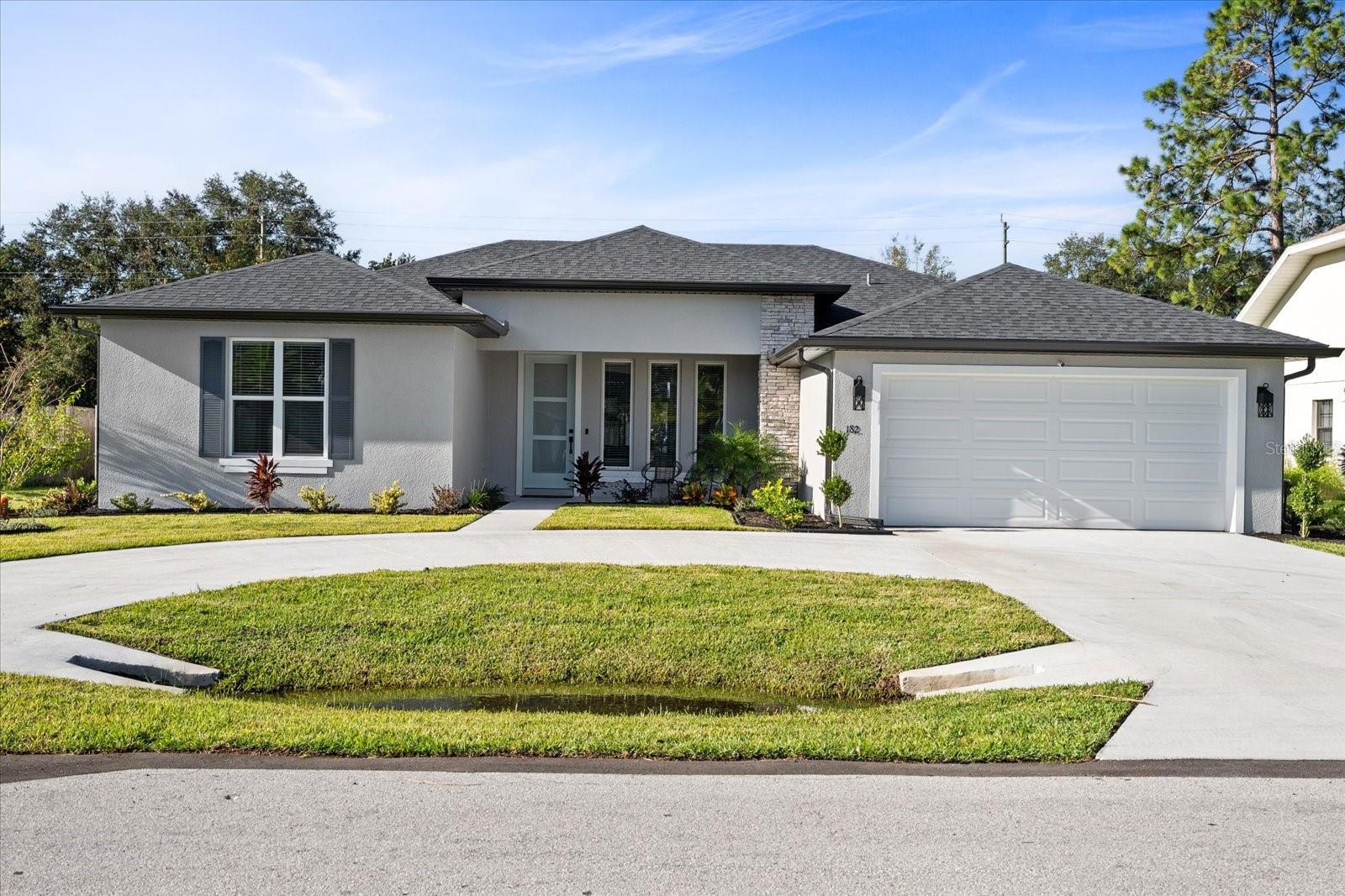 UP TO $15,000 IN BUILDER INCENTIVES AND $31,000 IN INCLUDED UPGRADES! Fully completed and move-in ready home! Welcome to this stunning brand-new construction home, where every detail has been thoughtfully crafted to offer elegance, comfort, and a modern lifestyle. From the moment you arrive, you'll be impressed by the striking 8-foot designer front door, which sets the tone for a home filled with sophistication, Tile throughout. Natural light pours through the front windows, bringing warmth into the heart of the home. The indoor space blends seamlessly with the outdoors thanks to a large 8-foot sliding glass door that opens to the covered lanai—perfect for enjoying the weather year-round. Soaring 9’4” ceilings enhance the feeling of spaciousness, while decorative finishes and Riverside-style doors add a refined touch. Designer lighting accentuates the open floor plan, creating a stylish and inviting atmosphere. The kitchen is a true culinary haven, featuring shaker-style cabinets, veined quartz countertops, an elegant backsplash, and matte black stainless steel appliances. The bathrooms are designed for relaxation, with matte black faucets, oil-rubbed bronze fixtures, and ceramic-tiled walls—delivering a timeless luxury experience. This is more than just a house—it's a statement of great taste, quality, and exceptional design. Contact us today and take the first step toward the lifestyle you deserve. Photos shown are of the model home located at 182 Bayside Dr. Model open daily from 11:00 a.m. to 5:00 p.m.