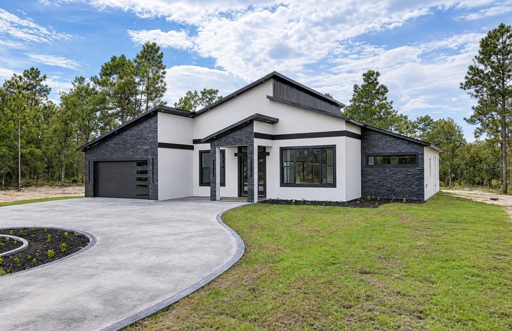 Photo of 7660 SW 138th Terrace, Dunnellon, FL 34432 (MLS # OM733973)
