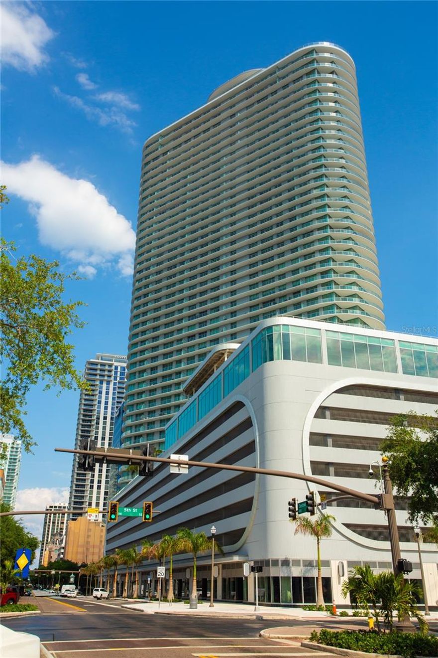 Now offered for purchase at 400 Central a rare opportunity to own in downtown St. Petersburg’s most iconic new luxury tower—offered at an exceptional entry-level price point with access to the dramatic 46th-floor Sky Lounge Observatory and a 36,000-square-foot amenity deck—offering a level of luxury and value without the significantly higher-floor price points within the tower.
This new, move-in ready, never-lived-in 2-bedroom, 2.5-bath home offers 1,358 square feet of refined interior living plus an expansive, full-length 288-square-foot private terrace (1,646 total), creating a seamless flow for elevated indoor-outdoor living. With its coveted southeast-facing orientation, the residence captures dynamic city views and meaningful Tampa Bay water views through floor-to-ceiling windows, filling the space with natural light.
Thoughtfully designed with elevated finishes, the home features an open-concept dining and living space with porcelain tile flooring; and a gourmet kitchen with quartz countertops, sleek Italian cabinetry with under-cabinet lighting, premium JennAir stainless steel appliances, a gas cooktop, and porcelain tile flooring, ideal for both entertaining and everyday living. The primary suite includes a spacious walk-in closet and a spa-inspired ensuite bath, while the open-concept layout delivers clean lines and a sophisticated, livable design.
Ownership includes access to 400 Central’s full suite of world-class amenities, including a 36,000-square-foot amenity deck with a resort-style heated pool, private cabanas, pool and game lounge, state-of-the-art fitness center, theater lounge, and an elegant private dining room; and the dramatic 46th-floor Sky Lounge Observatory. Built to the latest safety standards with fully funded reserves, the building delivers long-term value and peace of mind.    
Additional highlights include one secure parking space, a second valet parking space, and a private secure storage unit. The ground floor will feature curated retail, including Volta Wine + Market, further enhancing the elevated lifestyle experience.
Positioned in the heart of downtown St. Petersburg, residents enjoy a vibrant, walkable lifestyle just steps from waterfront parks, acclaimed dining, galleries, and cultural venues.
A rare opportunity to own a brand-new, never-occupied residence with strong city and water views in one of Tampa Bay’s most prestigious addresses.