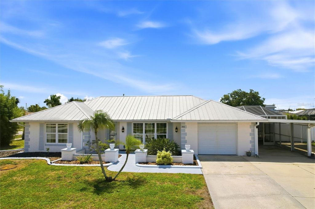 Photo of 361 Wherley Avenue SE, Port Charlotte, FL 33952 (MLS # C7524275)
