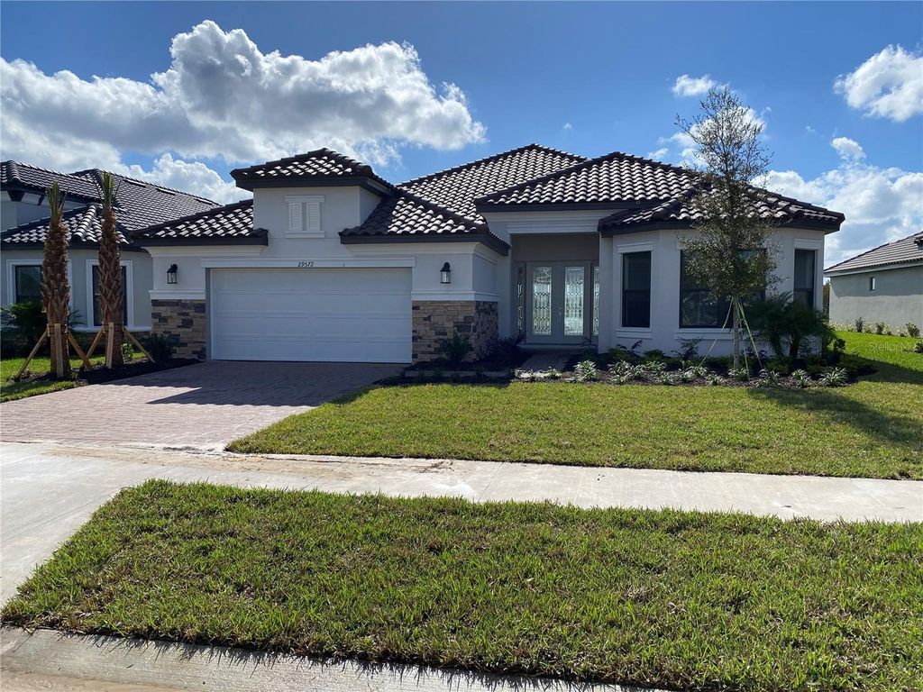 Photo of 29572 Toricelli Road, Wesley Chapel, FL 33543 (MLS # J969859)
