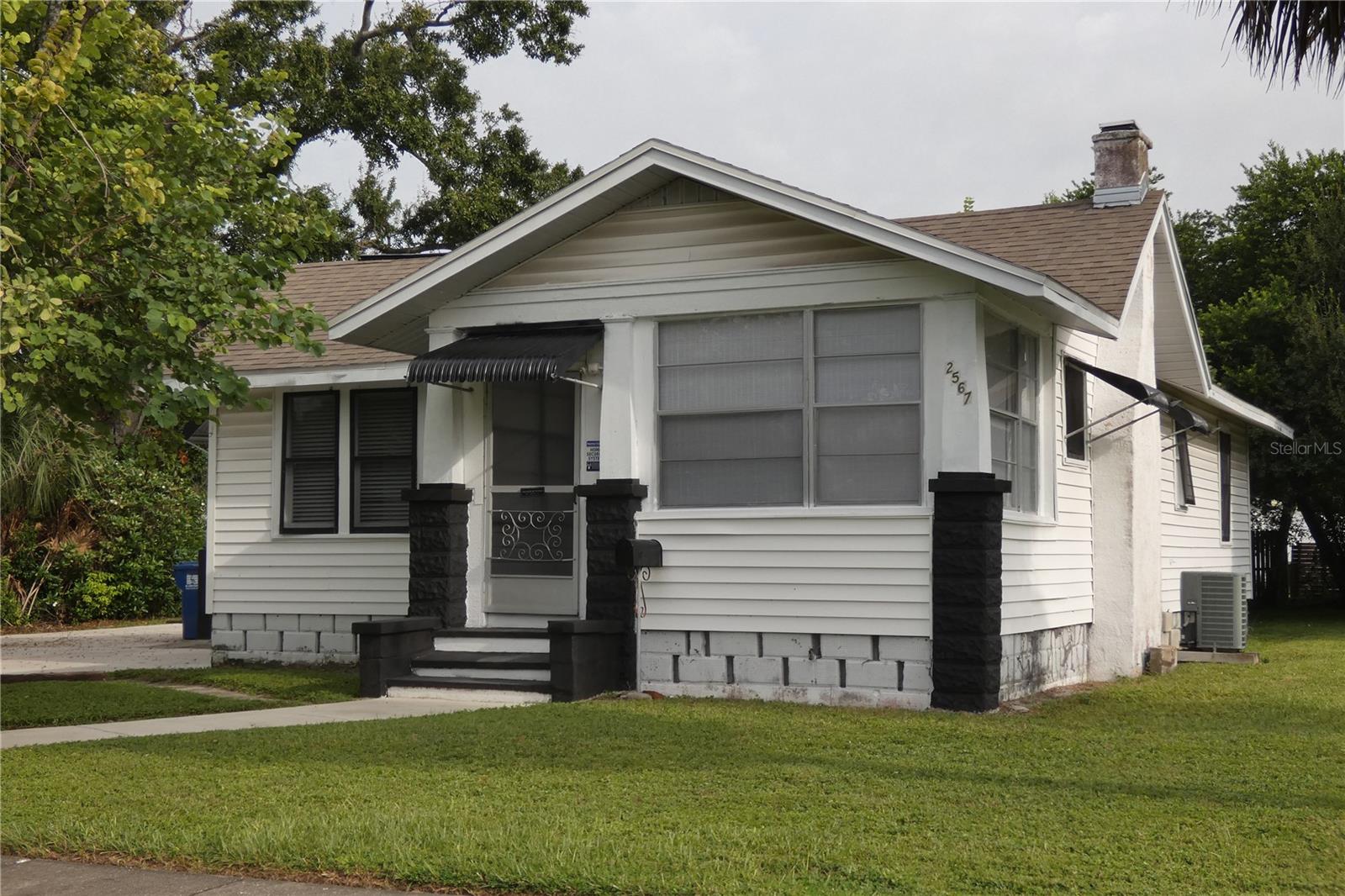 Large North St Petersburg home near downtown. NON FLOOD zone. Updated 2 bedroom 1 bath home with a Florida room and 2nd porch. Light & airy with a decorative fireplace. Over 1095 square feet of living space. Updated kitchen with granite countertops and period wood cabinets. Remodeled bathroom with granite countertop, Luxury vinyl plank flooring in ala rooms. Inside laundry room with washer and dryer connections. Rent includes water, sewer, garbage and lawn care! Small pets ok. Nice yard. Convenient to Downtown St Petersburg, 275 and the bay bridges. Rear detached duplex is not included in the rental. CLEAN! Won't last!