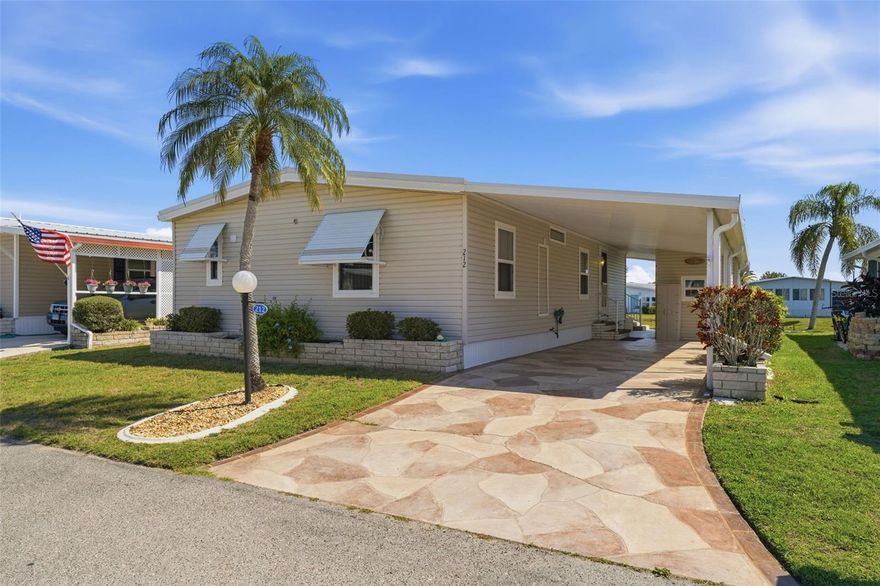 Welcome to Lazy River Village! One of the premiere (if not THE best) 55+ waterfront manufactured park in all of Sarasota and Charlotte counties! The BEST amenities, clubs, and selection of activities you will find in any co-op park in all of Sarasota county and even Charlotte County. Lazy River is located on the banks of the beautiful Myakka River. 

This 2/2 home is CUTE AS A BUG! Light-filled interior with newer windows. Well-maintained with an AWESOME WATER VIEW of Lake Cayman. Two walk-in showers (one in each bathroom). WALK-IN Closet in primary bedroom. Large Florida room with easy-to-care-for laminate flooring. Washer & dryer located in shed. Built-in storage and display space in dining area. Second bedroom has built-in desk. 

This home is the perfect seasonal place to enjoy Florida's coveted gorgeous winters and a perfect year-round home for those who love all 4 seasons of Florida. If you enjoy an abundance of activities, you will have plenty to choose from in Lazy River Village: Pickleball, tennis, bike clubs, card clubs, and pontoon boating. They even have a professional woodworking shop. A low monthly fee of $276 includes all the amenities. There are other amenities for an extra fee, such as a marina slip if your home is not located on the water. 

One of the things that makes Lazy River Village so great is its proximity to...well...everything! Be prepared to enjoy Florida's wildlife at its finest, both inside the Lazy River Village complex and at abundant state parks and nature preserves. Shopping and dining surround you in all directions. The spring training homes of both the Atlanta Braves & the Tampa Bay Rays are just a minutes away. The world-renowned Gulf of Mexico beaches are all within 30 minutes or less! 1) Englewood beach, 2) Casperson Beach (GREAT for shelling), 3) Venice Beach (shark tooth capital of the world), 4) Brohard Paw Park, 5) Nokomis beach (you've GOT to experience the weekly drum circles), 6) the island gem of southwest Florida: Boca Grande... And finally: 7) Siesta Key in Sarasota has been ranked multiple times as the number one beach in the nation and is a mere 35 minutes away. Lazy River Village offers a lifestyle that every retiree dreams of. You have the quaint downtowns of Venice and Punta Gorda--both cities are often ranked as Top 10 destinations in the country for retirement. Another local favorite, Englewood, is a cozy, fun beach town on the Gulf of Mexico. 

The residents of Lazy River Village agree: Lazy River is a community that offers it all. Don't miss your chance to see this home!