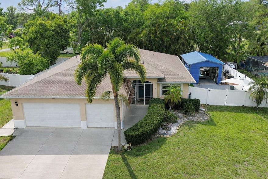 Tropical palm trees, space to spread out, and Florida living at its finest—welcome to this 3 bedroom + home office POOL home with a 3-car garage and workshop in Ellenton with NO HOA! 

From the moment you arrive, swaying palm trees and a welcoming entry set the tone for what’s inside. Step into a bright, open layout where the grand living room offers plenty of space to gather and seamlessly connects to both the kitchen and outdoor living areas—perfect for entertaining or simply enjoying everyday life. You’ll also love the formal dining room, offering the ideal space to host gatherings, holidays, or enjoy a more elevated dining experience.

The kitchen is designed to impress with granite countertops, stainless steel appliances, pantry storage, and a breakfast bar for casual seating. A sunny dining nook overlooks the pool, creating the perfect spot to start your day with coffee and a view.

The primary suite is a true retreat, featuring a spacious layout, large walk-in closet, and an updated private bath with dual sinks and a beautifully sized shower. Need extra space? The home office (currently a movie room) with built-in cabinetry gives you the flexibility for work, hobbies, or relaxation.

Step outside and fall in love with your own private Florida oasis 
This home was made for outdoor living with multiple spaces to relax, entertain, and unwind. The extended screened lanai with pavers and ceiling fans is ideal for dining or hosting, while the sparkling pool invites you to cool off and enjoy sunny days year-round. Kick back poolside, host friends at your tiki bar, or enjoy the low-maintenance convenience of pet turf already in place.

There’s even more to love outside with a separate pavered side patio and a double gate for easy access—perfect for parking your boat or extra toys. You’ll also appreciate the workshop shed with bay doors, ideal for projects, storage, or hobbies, plus an additional covered area and a 50-amp RV hookup ready to go!

The 3-car garage gives you plenty of room for vehicles, tools, and toys, and with no neighbors behind you, you’ll enjoy added privacy and peaceful views.

And the location ties it all together!
Living in Ellenton means easy access to I-75, making trips to Tampa, Sarasota, and the Gulf beaches quick and convenient. You’re just minutes from the popular Ellenton Premium Outlets, local dining spots, and everyday essentials. Plus, a short drive takes you over the Skyway Bridge into St. Pete and Pinellas County, opening the door to even more waterfront destinations, beaches, and entertainment.

This home truly checks all the boxes—space, flexibility, outdoor living, and an unbeatable location.

Come see it in person and start living the Florida lifestyle you’ve been dreaming of!