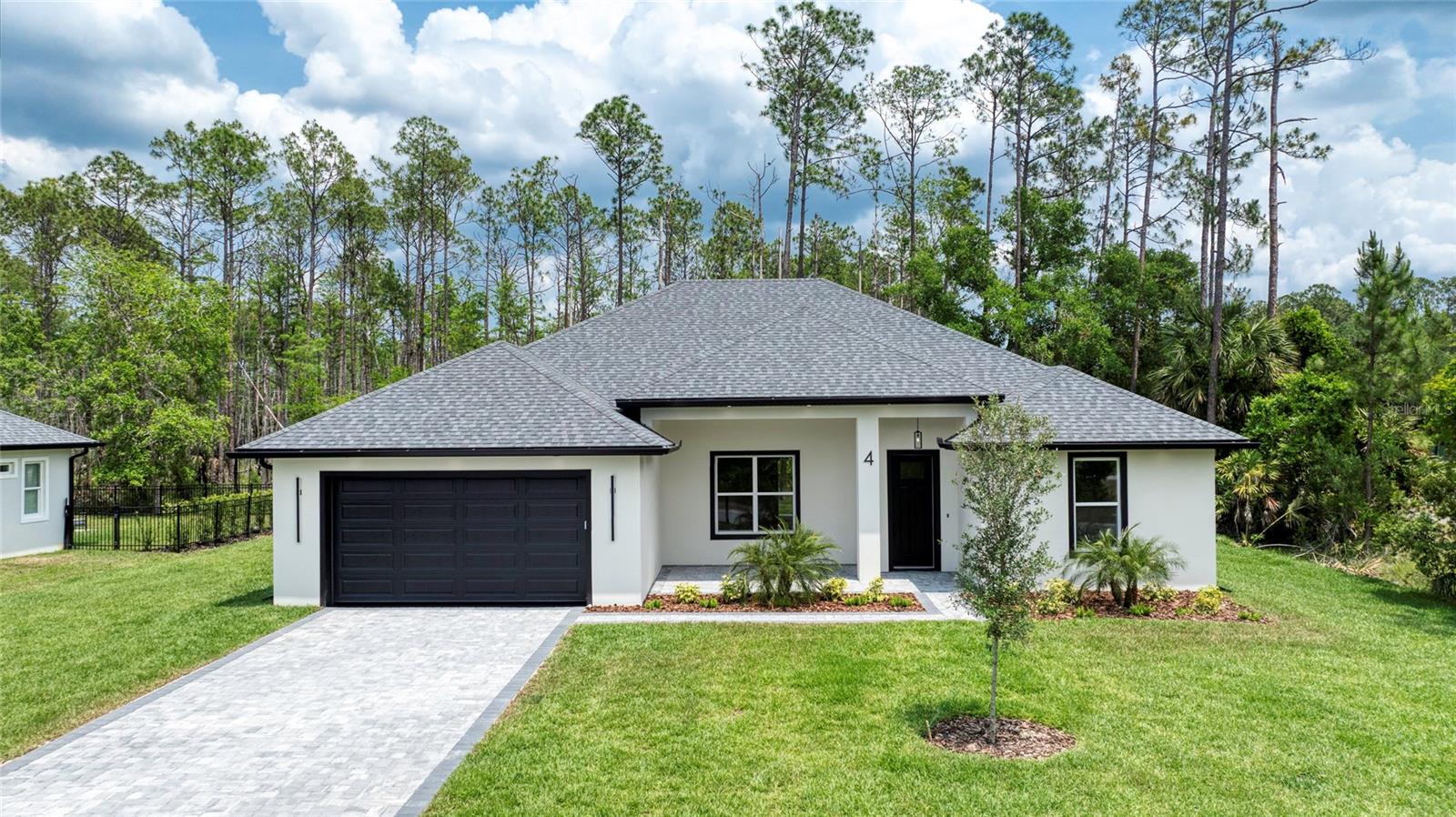 Introducing a stunning new construction home, complete 2025. Perfect for those seeking a modern and spacious, high quality home. 4 bedrooms ideal for families, guests or home office. 3 luxury bathrooms with contemporary modern design that reflects the latest trends. Home offers large windows which fill the home with natural light and spacious living areas. Other features include paver driveway, epoxy garage flooring, lush landscaping, Master-built in closet shelving system and upgraded door and window trim. This energy efficient home is a perfect blend of style, comfort and craftsmanship.
