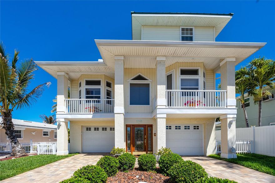 On the Intracoastal Waterway in Treasure Island's Isle of Palms, three blocks from the Gulf, this elevated custom home was designed around a very specific kind of morning. The coffee happens on the dock or one of the balconies. The dolphins swim through the canal. The sunrise over the intracoastal serves as your wake-up call. 
Built in 2000 and meticulously cared for by its original owner, the home reflects genuine craftsmanship throughout. Inside, extensive built-ins, crown molding, recessed lighting, and surround sound are evident are bonus features. The chef's kitchen is appointed with 42-inch custom cabinetry, a center island, stone countertops, and a pull-up breakfast bar that opens directly into the main living areas — a floor plan built for gathering. A propane gas fireplace anchors the living room with elaborate built-in shelving for your artwork, books or treasured belongings.
French doors open to the expansive primary suite on the third floor, where a large walk-in closet and a spa-inspired ensuite make a case for unhurried mornings. The bath includes dual sinks, a dedicated makeup vanity, a soaking tub, and a walk-in shower. Two additional bedrooms, each with walk-in closets, complete this thoughtful floor plan.
Outside, a private pool and spa sit within a resort-style setting with extensive landscaping and underground sprinkers, while the private dock offers direct intracoastal access. Multiple balconies frame the waterfront from every level. A rare four-stall garage at street level serves as storage for everything your coastal life requires.
Major updates are already in place: metal roof (2019), seawall (2018), HVAC upstairs (2018) and downstairs (2022, with a two-year service warranty), pool pump (October 2024), and professionally tented (May 2025). No HOA.  Need more peace of mind?  The owner had a complete home inspection done prior to listing.  Move right in!
Treasure Island's dining, shops, and entertainment are steps away, with John's Pass Village just minutes to the north. Downtown St. Petersburg is approximately 25 minutes and Tampa International Airport is within 40 minutes.