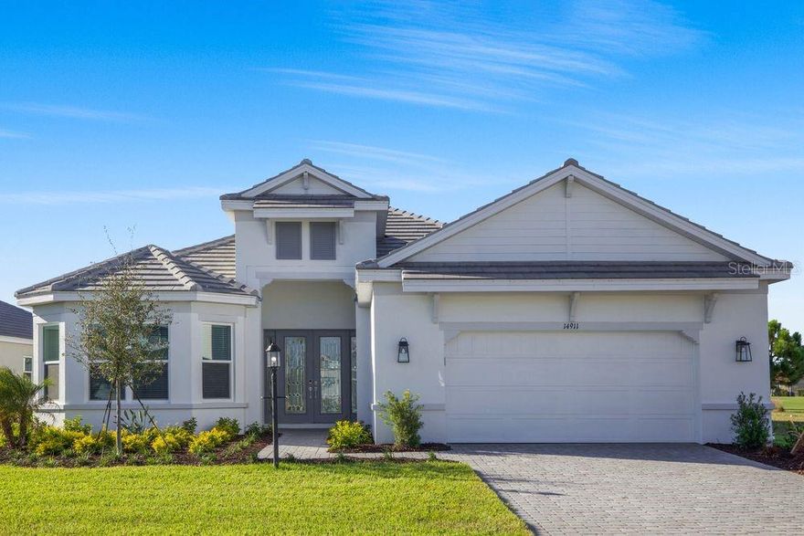 New Construction - Ready Now! Built by Taylor Morrison, America's Most Trusted Homebuilder. Welcome to the Pallazio at 14911 Contenta Loop in Esplanade at Azario Lakewood Ranch! This stylish new home features an open layout with a spacious great room, dining area, and gourmet kitchen with a large island and casual seating. The private primary suite offers a bay window, elegant bath, and oversized walk-in closet. Two guest bedrooms are located at the front—one with a private bath, the other near a full bath and a versatile study. Enjoy indoor-outdoor living with pocket sliding doors leading to a covered lanai with a built-in outdoor kitchen. Come explore the Pallazio and experience resort-style living at its finest! Additional Highlights Include: Gourmet kitchen, study in place of flex, bay window at primary suite, tray ceiling at primary suite and great room, 8' interior doors, extended covered lanai, outdoor kitchen with stainless steel vent hood, and tandem garage. MLS#A4659015

Resort-Style Living at Esplanade at Azario Lakewood Ranch, the perfect blend of relaxation and recreation! Enjoy the heated resort-style pool, state-of-the-art fitness center, and energizing aerobics classes. For outdoor enthusiasts, there are pickleball courts, scenic trails, Vitality Park, and if golf is your game, you'll love Esplanade's 18-hole championship course! Unwind with a facial massage or by the fire pit after a workout. Exclusive amenities like a Wellness Center, Culinary Center, and sports courts ensure there's something for everyone, whether you want to stay active or relax in style.