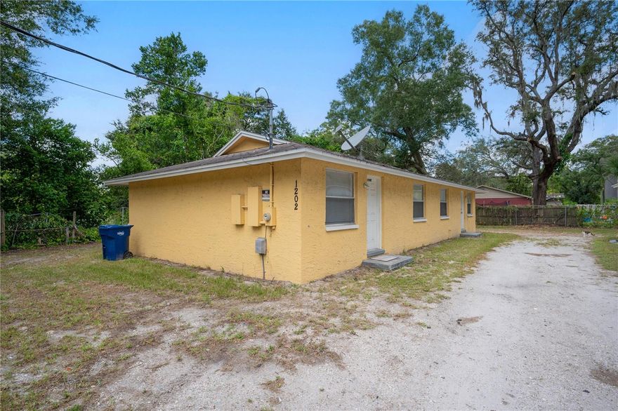 One or more photo(s) has been virtually staged. This sale includes 1202 E 99th Ave. #AB (A-19-28-19-454-000053-00009.0), and 1204 E 99th Ave. #AB (A-19-28-19-454-000053-00008.0).  OWNER WILL NOT SEPARATE.  OFFERING MEMORANDUM AVAILABLE via email.  FINANCING PACKAGE THROUGH CHRIS DOERING MORTGAGE available to new buyer.  OWNER WILL DELIVER CLEAN 4-POINT AND WIND MITIGATION REPORTS FOR BOTH UNITS.  INDIVIDUAL ELECTRIC METERS with TENANTS PAYING ELECTRIC.  ONE WATER LINE PER BUILDING with OWNER CURRENTLY PAYING WATER.  This income producing triplex is an excellent investment opportunity featuring LOW VACANCY RATES and a desirable cul-de-sac location.  Sitting on an OVERSIZED FENCED LOT, this property is conveniently located near USF and Busch Gardens, making it an attractive option for renters.  Additionally, it is easily accessible via I-275 for those who need to commute to work.  SEPARATE LAUNDRY ROOMS for each unit, NO CARPET, central heat and air, and AMPLE PARKING.  Optional conversion of 4 bed / 2 bath unit back into a 2 bed / 1 bath duplex, further increasing profitability.  With its prime location and solid rental history, this asset is a must-see for any savvy investor looking to boost their income stream.  OWNER WILL NOT SEPARATE.  OFFERING MEMORANDUM AVAILABLE.