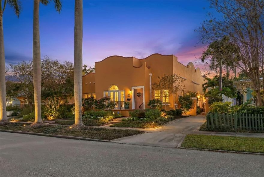 Step into the romance of Mediterranean architecture seamlessly blended with modern luxury in this stunning 1926 Spanish-style home, nestled in the heart of the sought-after Old Northeast neighborhood. Just two blocks from the waterfront and an easy stroll to downtown, this home captures the essence of St. Petersburg living—where historic charm meets vibrant city lifestyle. Inside, nearly 2,000 square feet of thoughtfully designed living space highlights the home’s original character, from the warmth of refinished hardwood floors to the inviting fireplace, and French doors opening to a Juliet balcony that beckons morning coffee or evening cocktails. The home’s floor plan feels both gracious and practical, with tall ceilings, natural light, and inviting spaces that flow effortlessly for entertaining. The kitchen was reimagined in 2023 and is now a true showpiece with custom cabinetry, designer wallpaper, a gas stove, open shelving, and statement lighting. The primary suite shines with a custom California Closet and a spa-like bathroom renovated in 2024, featuring heated floors, bespoke fixtures, and an airy layout designed for daily indulgence. Guest quarters were enhanced with a new Jack-and-Jill bath, and thoughtful touches like designer wallpaper, curated finishes make the home feel elevated and timeless. The outdoor spaces deliver an entertainer’s dream, with a sparkling pool, spa and lush tropical landscaping. The detached garage has been transformed into a stylish guest studio with loft, full bath, kitchenette, and French doors opening to a breezy covered patio with dual fans—perfect as a retreat, creative space, or guest getaway. Recent upgrades add peace of mind and efficiency, including solar panels, a new A/C system, expanded paver driveway, and redesigned tropical gardens with full irrigation. Situated in a prime X flood zone location, this home offers both historic beauty and modern convenience. With its unmatched blend of character, luxury, and location, this Old Northeast treasure is more than a home—it’s a lifestyle.