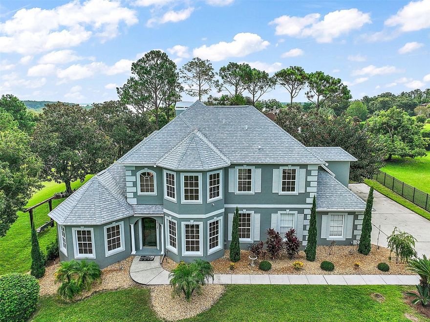 Experience luxury living in Gourd Neck Springs, a private, gated waterfront community with exclusive resident-only access to Lake Apopka via a private boat ramp. This beautifully renovated 4-bedroom, 3.5-bath home sits on a 0.69-acre fully fenced corner lot and showcases over $250,000 in recent updates, offering stunning water views, a screen-enclosed pool, and premium finishes throughout.
Major Renovations Include:
Fully painted interior, exterior, pool deck, and garage (epoxy flooring by OX Floors in garage and pool deck)New pool deck drain, pool screen, and heat pump
Outdoor kitchen & bar with built-in grill, cooktop, TV hookup, and sound system
New paver patios, fenced backyard, and refreshed landscaping with all new bushes
New insulated garage door and mini-split A/C in garage
Upgraded heat pump with multiple zones
New flooring throughout home
Custom staircase treads and railings
New custom kitchen with granite countertops, full granite backsplash, and gas cooktop with pot filler
Breakfast nook and living room entertainment center with custom cabinets and seating
Updated baseboards, hinges, and door hardware throughout
Luxurious master bath remodel with custom cabinets and spa-style shower
Custom bedroom closet systems
Half-bath with marble accent wall
Complete re-plumbing of the home with new faucets and valves
Automatic fire sprinkler system for enhanced safety

Interior Highlights:
As you step inside, you’ll be greeted by soaring ceilings, crown molding, and oversized windows that flood the home with natural light. The open floor plan creates an airy flow, featuring a formal dining room and a versatile sitting area or office. The main-floor primary suite offers breathtaking lake views, a walk-in closet, and a spa-like en-suite bath with dual vanities, a jetted tub, and a separate shower.
Upstairs, enjoy a private junior suite with its own full bath, plus two additional bedrooms and another full bathroom.

Outdoor Living:
The screen-enclosed pool and expansive covered lanai create the perfect setting for relaxation and entertaining. With a full outdoor kitchen and bar, plus new paver patios and a beautifully landscaped backyard, this home is ideal for enjoying Florida’s year-round sunshine.

Location:
Just minutes from Montverde Academy, Bella Collina, and downtown Winter Garden, with easy access to the West Orange Trail, Orlando’s major attractions, and the international airport.

This move-in-ready home combines luxury, comfort, and thoughtful updates—making it a rare find in one of the area’s most sought-after communities.