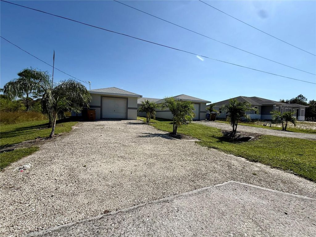 Photo of 777 Bedford Drive, Lehigh Acres, FL 33974 (MLS # TB8477274)