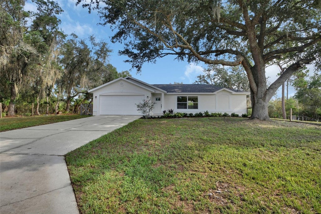 Photo of 1251 Seminole Drive, De Leon Springs, FL 32130 (MLS # V4949968)