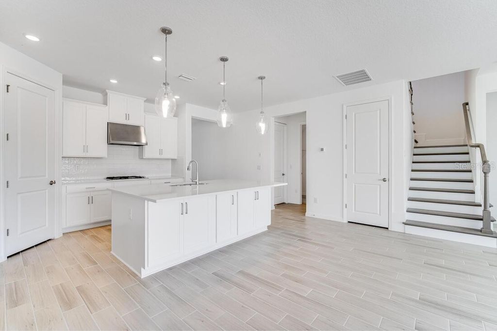 Photo of 34019 Landsman Loop, Wesley Chapel, FL 33543 (MLS # T3513040)