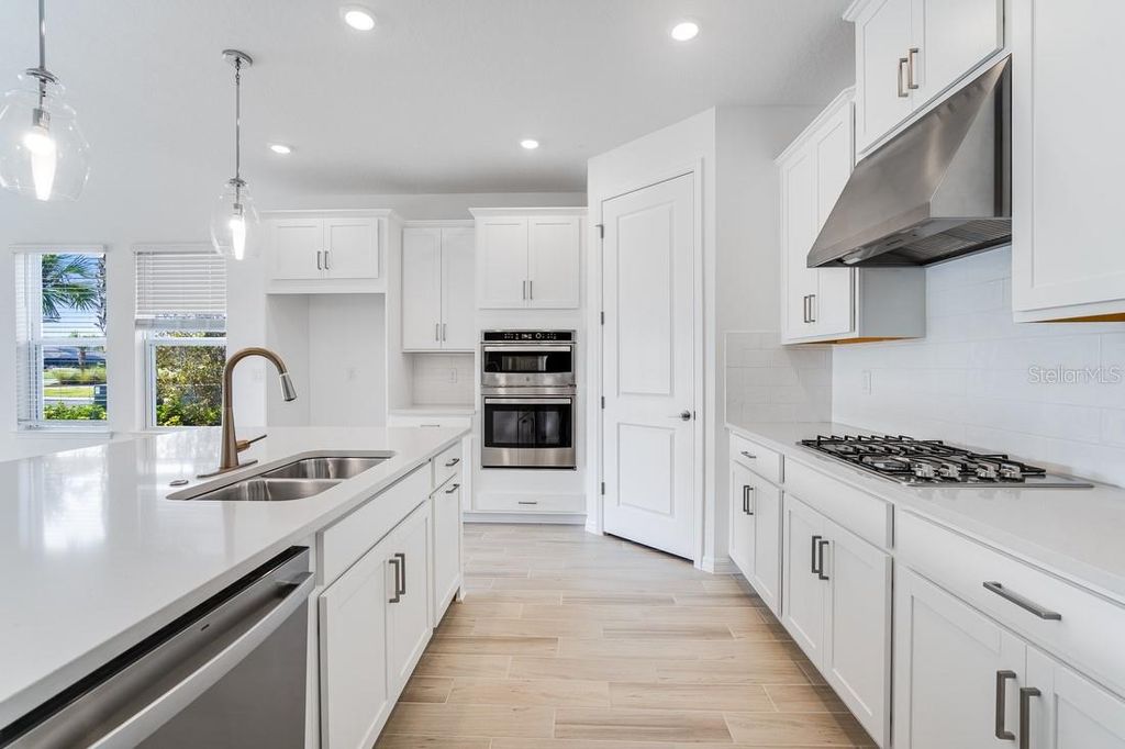 Photo of 34019 Landsman Loop, Wesley Chapel, FL 33543 (MLS # T3513040)