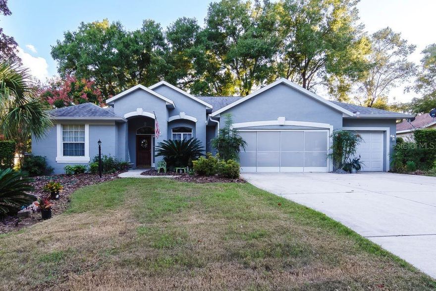 Welcome to Rainbow Springs Country Club, a premier community in Dunnellon/Ocala. This move-in ready home sits in a quiet, private setting. It offers comfort, convenience, and modern style. The house has 3 bedrooms and 2 bathrooms. There is a 3-car extended garage. The living space is 2,049 sq. ft. The lot is .26 acres and beautifully landscaped. Built in 1998, the home features a split bedroom floor plan. Guest rooms are spacious. The owner's suite has two walk-in closets, a shower, and a jet tub. The kitchen has solid wood cabinets, pull-out drawers, and granite countertops. The screened lanai is large and overlooks a tree-shaded backyard. It includes custom blinds, a sink, and cabinets for outdoor food prep. The home has a separate well for lawn irrigation. There is also a water softening system. The grounds have flowering shrubs and mature trees. The property is well maintained. Rainbow Springs residents enjoy many amenities. There is a private beach on the Rainbow River. You can use the kayak launch, grills, and pavilions. The community center has a restaurant, swimming pool, tennis and pickleball courts, fitness center, and frisbee golf. Schedule your private showing today!