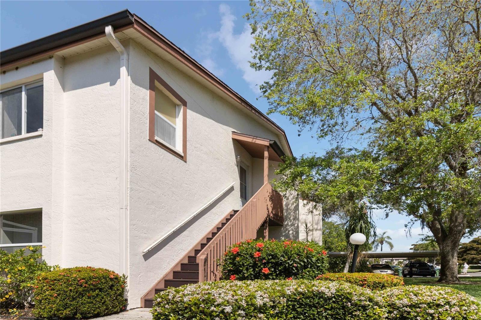 Welcome to your Florida oasis in this inviting turn-key, 2 bedroom, 2 bathroom condo tucked away in the serene 55+ community of Country Village. Set on the second floor of a two-level complex, this home offers enhanced privacy, security, and the added comfort of a recently replaced AC unit in 2020. Designed with a split floorplan, this condo ensures practicality and comfort for everyday living. Inside, you will find the convenience of an interior laundry area, making the chore a breeze! All furniture and furnishings will convey with the sale of the property. If it is there when you take your tour, it will be there on closing day! Enjoy the array of community amenities, including a clubhouse, pool, gym, shuffleboard court, tennis courts, and a tranquil relaxation area. Positioned in the most peaceful corner of the association, open your lanai windows to welcome a heavenly breeze that flows throughout the unit, creating an atmosphere of utter relaxation. Conveniently located near Anna Maria Island, downtown Bradenton, and Sarasota, you'll have easy access to vibrant nightlife and cultural activities . Explore the lively streets, trendy eateries, and unique shops that define these dynamic areas. For a day of sun-soaked relaxation, head to nearby Anna Maria, an island renowned for its pristine beaches and charming atmosphere. Spend your days lounging on the sand and exploring the islands quaint streets and delectable seafood restaurants. With proximity to Tampa and Sarasota airports, as well as being just 2 miles from Blake Hospital, this location offers both convenience and peace of mind. Experience the epitome of maintenance-free living, allowing you to fully embrace the Florida lifestyle without any hassle. Don't miss out on this affordably priced and conveniently located condo. Seize the opportunity to turn your Florida dream into a reality today!