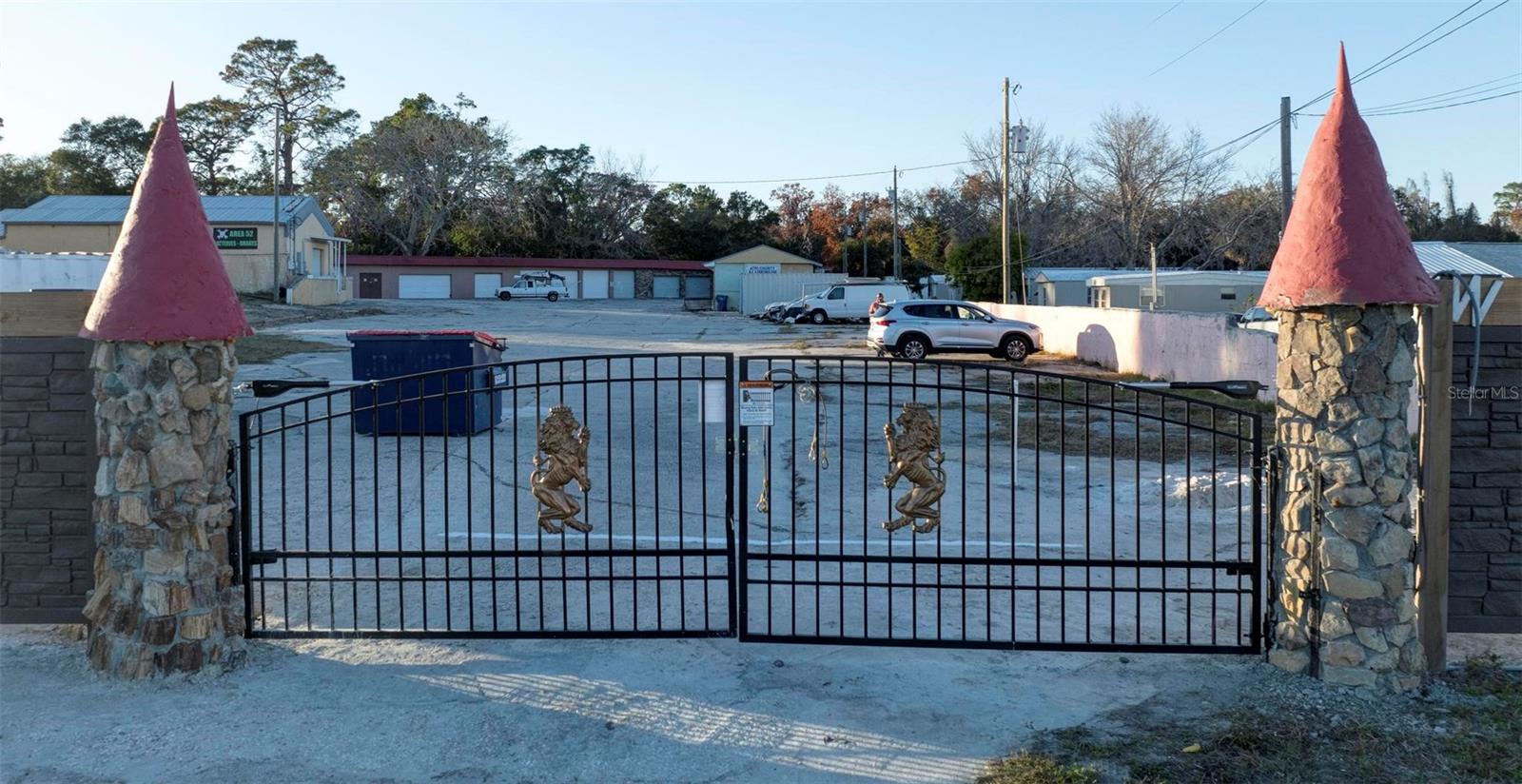 BUSINESS OPPORTUNITY KNOCKS!!! Zoned C-2 on Commercial Way , N. Hudson, FL. on 1 -1/2 acres is this amazing rental income producing gated property. Individual garages can be used for storage, auto-detailing shop, office rentals or many other usage. Very reasonable way to store your valuables in these shipping containers in a secure and safe location. Enough lot space for possible used car sales..... or any other type of business. Come discover this business opportunity.