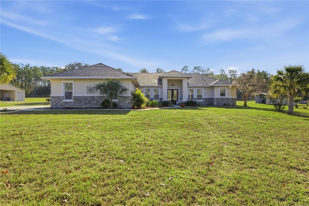 Photo of 6081 W Pell Place, Dunnellon, FL 34433 (MLS # OM716140)