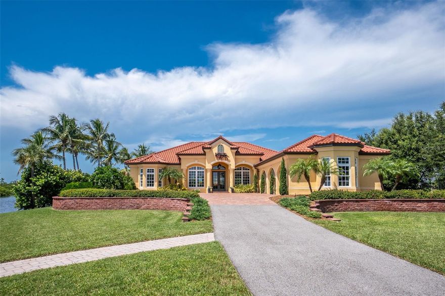Experience an unparalleled waterfront lifestyle with this extraordinary Punta Gorda compound—an estate unmatched in privacy, land, and luxury throughout the surrounding area. Set on just under 2 acres with no deed restrictions, this private gated property offers resort-style living, exceptional boating amenities, and expansive grounds rarely found in Southwest Florida. Located on a quiet dead-end canal with minimal boat traffic and an easy idle-out to Charlotte Harbor, the setting is peaceful, private, and ideal for boating enthusiasts, and the home itself has never flooded. Built by Arthur Rutenberg and pristinely maintained by its original owner, the residence spans 3,279 sq ft with an open layout designed for elevated entertaining. The updated kitchen features Bosch black stainless appliances and generous workspace, while the living room showcases a Lake Como–inspired mural that enhances the Mediterranean feel of the home. The primary suite offers a spa-inspired bath featuring a stunning rain shower, an electric bidet, separate vanities, and a beautiful stone soaking tub framed by elegant rain glass, all positioned to capture serene morning sunrise views to begin your day. The kitchen, family room, and primary suite were all refreshed in 2022. The one-of-a-kind den is custom-built with five different woods, creating a warm, rich, and distinctive statement space ideal for an executive office or optional additional bedroom. Outdoor living defines this compound, featuring an open-air heated saltwater pool and spa, a private shell beach and firepit, and luxurious landscaping that adds a park-like setting, along with multiple seating areas both under-truss and within a charming gazebo off the guest room surrounded by a garden—perfect for enjoying expansive sunset views and watching boaters move through Buckley’s Pass. For boaters, the property offers two 40-foot docks, a boathouse over the boat lift with power and water, and a private boat launch—an exceedingly rare amenity in the area—along with smooth idle-speed access to Charlotte Harbor. Additional features include a 3-car epoxy-floor garage, impact windows and doors, a clay roof, an updated water heater and pool pump, and low Charlotte County taxes. With nearly 2 acres of usable land, the estate also provides ample space to add a pickleball court, tennis court, basketball court, or a full guest house for enhanced future value. This remarkable offering is more than a home—it's a private coastal compound delivering unmatched land, luxury, privacy, and boating amenities, standing alone as one of the most distinctive properties in all of Southwest Florida.