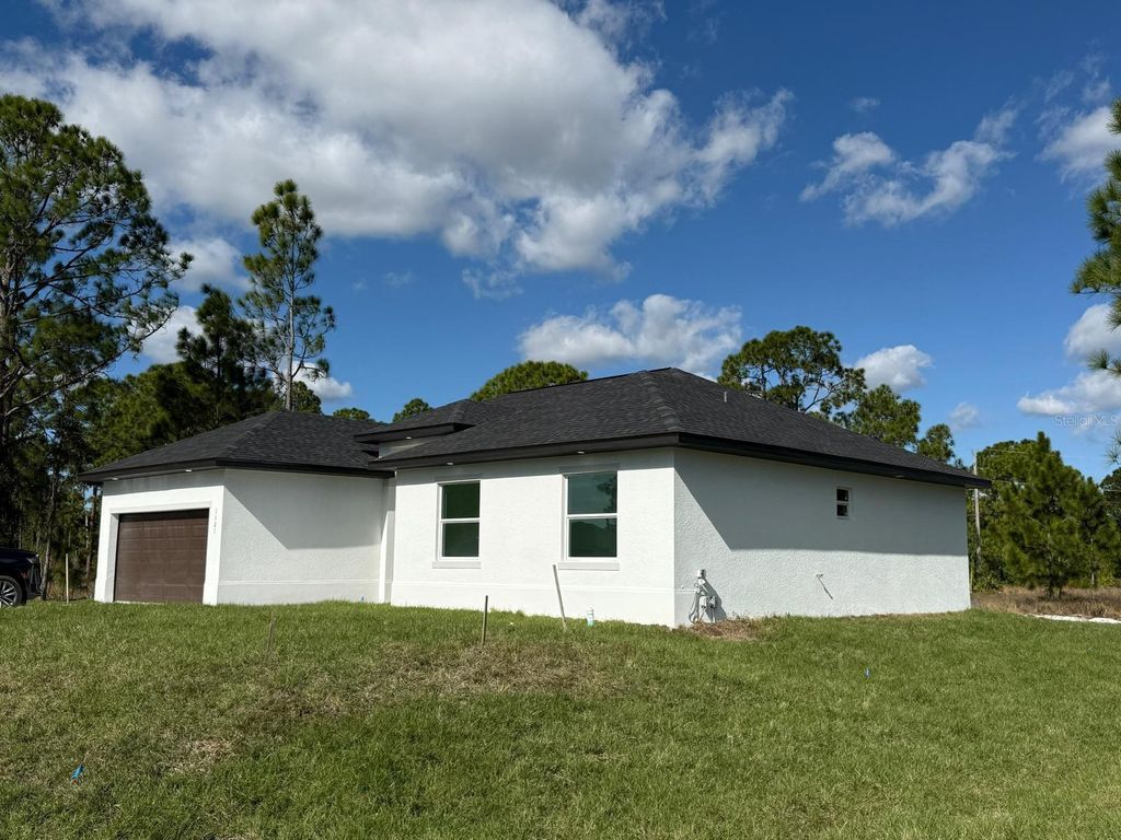 Photo of 1121 Florence Street E, Lehigh Acres, FL 33974 (MLS # S5142602)