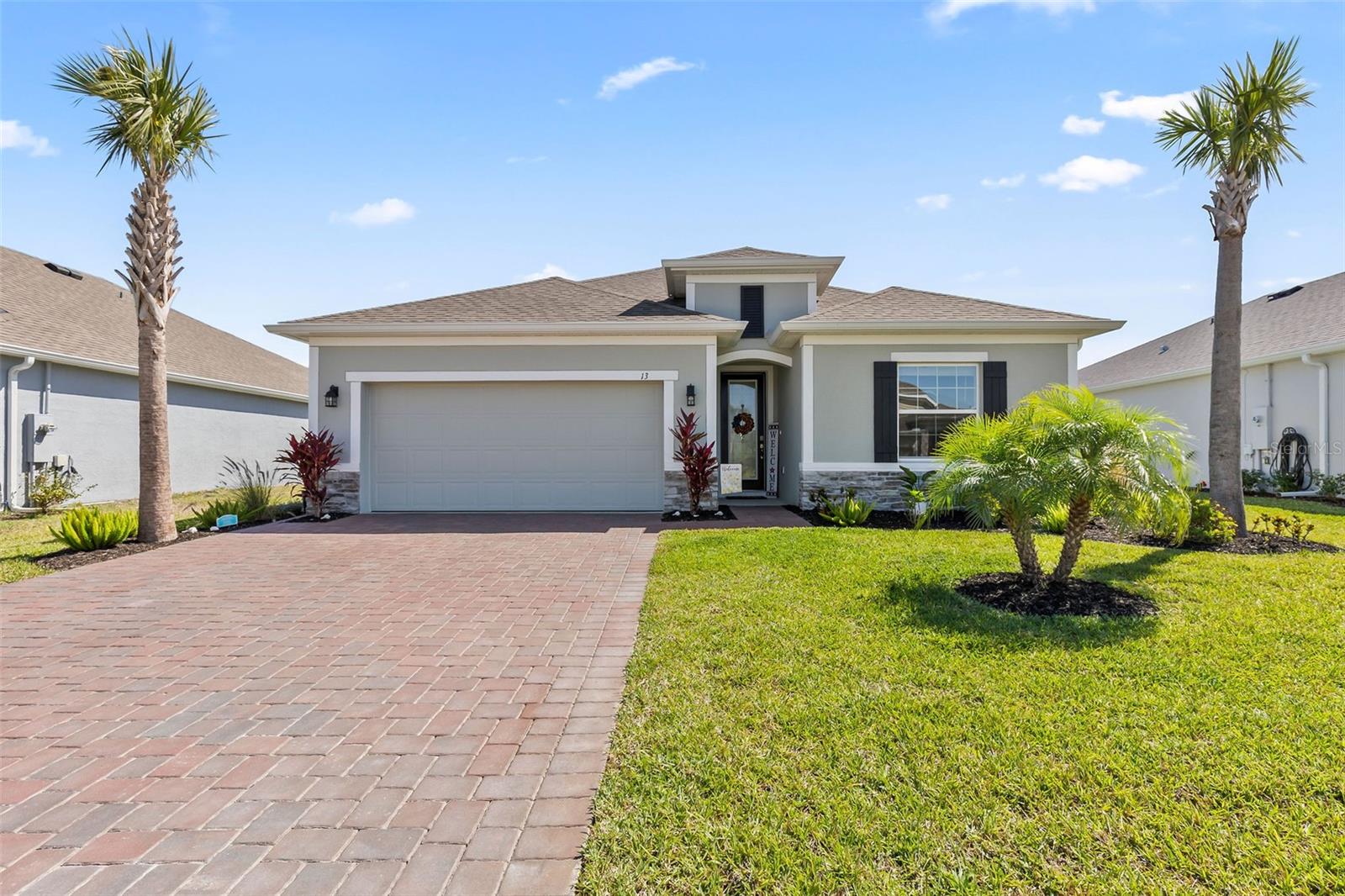 Hello there Beautiful! This absolutely gorgeous home is located in Huntington Green at Hunters Ridge, a lovely 55+ community in Ormond Beach, Florida! This nearly new home is in pristine condition, eagerly awaiting new owners to make it their own. The kitchen features soft-close cabinets and quartz countertops. The white subway tile backsplash beautifully complements the cabinets, creating a timeless yet sophisticated appearance. The owners invested significantly in upgrades, including crown molding, 6-inch baseboards, 9-foot ceilings, and tray ceilings in both the entry foyer and the primary bedroom. Luxury vinyl plank flooring extends throughout all the main areas of the home, while cozy carpeting graces the bedrooms. With four bedrooms and three full baths, there is ample space for guests. Each bathroom features quartz countertops. The primary suite is incredibly spacious, featuring picturesque views of the pond.
The bathroom is equally roomy, equipped with a soaking tub and a walk-in shower. You'll find ample countertop space along with numerous drawers for storage. A walk-in closet completes this space. Enjoy your morning coffee on the screened lanai. In the evenings, savor cocktails on the patio while watching the sun set over the pond. This property offers ample space to entertain, both indoors and outdoors. Huntington Green amenities include its own pool and clubhouse, and you also have access to the pool at Hunters Ridge. Savor the vibrant community around you, with the beach, shopping, and great restaurants just minutes away!