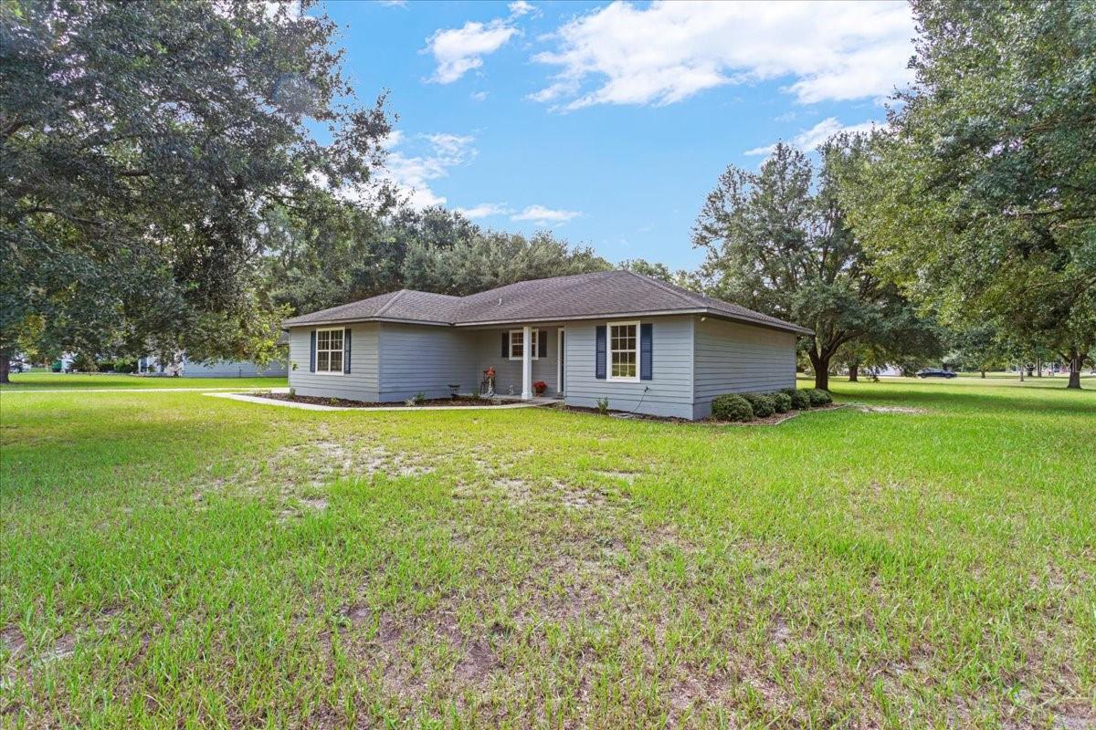 Charming 3-Bedroom Home on 1 Acre in RiverGlen – High Springs Living at Its Best!
Nestled beneath mature oak trees on a spacious 1-acre corner lot, this 3-bedroom, 2-bathroom home in the desirable RiverGlen Subdivision offers the perfect blend of comfort, convenience, and low-maintenance living.
Step inside to find a bright and airy open floor plan with soaring vaulted ceilings and quality vinyl plank flooring throughout—durable, stylish, and easy to maintain. The kitchen and living spaces flow seamlessly, ideal for entertaining or enjoying everyday life. Both bathrooms are thoughtfully designed, and the roomy garage provides plenty of storage or workspace.
The exterior is just as impressive, featuring low-maintenance Hardi board siding and a large yard with plenty of room to relax, garden, or play under the shade of the oaks.
Located just minutes from downtown High Springs, multiple springs and rivers, local shopping, and High Springs schools, this home offers all the perks of small-town living with quick access to outdoor recreation and nearby conveniences.
This home is the perfect combination of charm, space, and location. Don’t miss your chance to own a piece of High Springs living in RiverGlen—schedule your showing today!