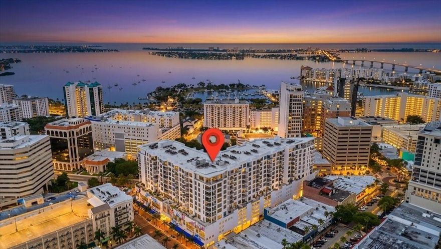 Design forward luxury at The Mark, where elevated living meets refined coastal elegance. This impeccably maintained End unit residence features three-bedroom, three and a half bath with a private office and showcases a seamless blend of sophistication and comfort, all framed by captivating Sarasota Bay views.


From the moment you enter, walls of glass invite natural light to pour into the expansive living and dining spaces, creating an airy ambiance with soaring 10-foot ceilings.  Breathtaking panoramic views of Sarasota's vibrant skyline and bay vistas from the living areas and bedrooms. Upscale custom remote-controlled window treatments allow you soft daylight with privacy when wanted. The open-concept design flows effortlessly to a generously sized balcony—accessible from both the family room and the primary retreat—offering a serene setting to enjoy morning sunrises or evening sunsets over the Sarasota Bay.


A standout feature, the glass-enclosed office provides the perfect balance of privacy and connectivity—ideal for working from home while remaining visually engaged with the main living areas.


The chef’s kitchen is both striking and functional, appointed with sophisticated European-style 2-tone cabinetry with soft close drawers, quartz countertops, and a full suite of Jenn-Air stainless appliances. Clean lines and a light, modern palette, and porcelain tile throughout enhance the home’s timeless appeal. 


The primary suite is a true retreat, featuring private balcony access, two custom walk-in closets with built-ins, and a spa-inspired bath with dual vanities, a frameless glass shower, and refined finishes throughout. Two additional bedrooms  with en-suite bathrooms provide comfort and privacy for guests.  A stylishly appointed powder bath is ideal for all of your guests and family.


Every detail has been thoughtfully curated, from designer lighting to high-quality materials, delivering a polished and cohesive aesthetic throughout the residence. The residence includes 2 premium 3rd floor adjacent parking spaces in the secured parking garage and a storage unit within the building on the same level as unit.  Quick access just 2 floors down to the amazing 5th floor amenities


Residents of The Mark enjoy world-class amenities, including a large pool deck area, 65 foot resort-style heated saltwater pool and spa, cabana areas, fire pit and lounge area, outdoor grills, state-of-the-art fitness center, club lounge with a fireplace, bar, billiards, catering kitchen, and newsroom cafe, and 24-hour concierge services—all just steps from Sarasota’s vibrant dining, shopping, and cultural scene.


A rare opportunity to own a sophisticated bay-view residence in the heart of downtown Sarasota