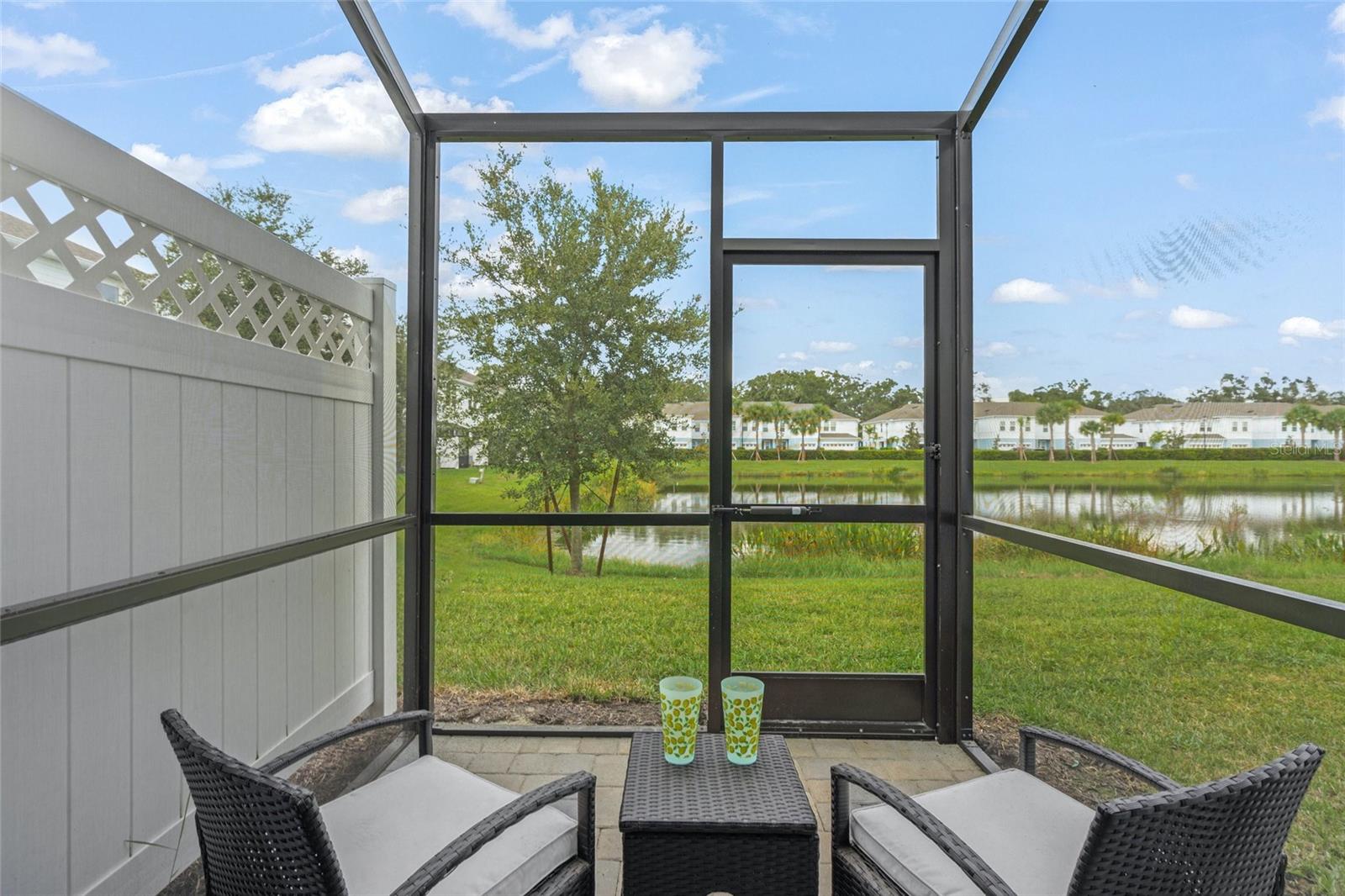 Upon arriving at the quaint community of Sienna Park Townhomes at University in prestigious Sarasota, enter through the gated entry to the 1,853-square-foot residence’s driveway. A paved porch leads into the foyer accessing the sprawling great room and second level stairway. Followed by an open gourmet kitchen, premium stainless appliances and large breakfast bar island. The dining area with a wine cooler opens to a screened lanai overlooking serene water views of the expansive pond. Enjoy its surrounding awe-inspiring wildlife, nature, garden, lush landscape and greenery. Ultimate privacy awaits as you do not have another row of homes backing up to your residence, adding peace and tranquility as the new construction phases available do not have this. Receive the benefit of like new, move-in ready with all new construction occupancy tasks completed. Simply start enjoying resort-style living. Recently built with a neutral palate and upgrades including quartz countertops in the kitchen and two baths, luxury wood ceramic tiles, hardwood hallway flooring, stairs and banister with spindles. Along with being wired for a smart home system and with a video doorbell installed. Laundry room is walk-in with washer, dryer and 42-inch cabinetry on the second level to easily access all bedrooms. Featuring a split floor plan of three bedrooms with one bedroom used as a den and office, two full baths on the second level and a half bath on the first level. One-car garage has upgraded epoxy floors with storage shelving. Relax poolside on chaise lounges, swim in the heated pool, on-site restrooms, couch area, grilling area, high-top bar seating and tables with umbrellas. Great for entertaining and sipping a cool refreshment while eating a grilled dinner after taking a swim. Take a visit on the nature trail through the preserve at east end of the community. Dine at the many options at UTC, Lakewood Ranch Main Street or Waterside, downtown Sarasota and St. Armands Circle. Visit museums, art galleries, opera, ballet and theater. Shop at specialty grocery stores including Whole Foods, Fresh Market, Detwiler's and Publix. Vicinity to golfing, Sarasota International Airport and Interstate 75. If you own a boat, you have Marina Jack or may spend a day at Lido Beach. Start living your suburban, urban or coastal lifestyle you have been waiting for.