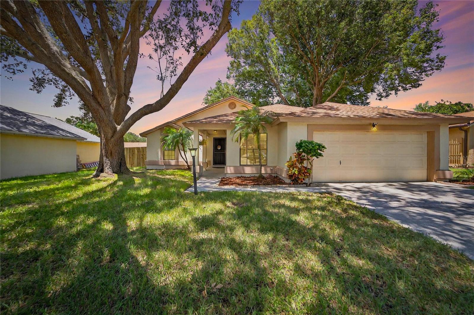 Welcome to this meticulously maintained split floor plan 3-bedroom, 2-bathroom home located on a quiet street that ends in a cul-de-sac. The heart of the home, a newly remodeled kitchen (2024), shines with modern finishes and provides a delightful space for preparing meals and gathering with family. You can move in with peace of mind knowing all the major "big ticket" items have been recently updated: HVAC (2019), water heater (2024), and a brand-new roof will be installed prior to closing (2025), ensuring years of worry-free living. The outdoor space is just as impressive. The backyard is a private oasis, completely enclosed by a new wooden privacy fence (2025). Enjoy the shade of a magnificent mature oak tree and established landscaping. The back porch extends onto a paver patio, creating the perfect setting for entertaining guests or simply enjoying the Florida weather. There's plenty of room for family and pets to play safely. Commuters will appreciate the home's superb location, offering easy access to both I-75 and I-4. This low-traffic street provides a safe and private environment, making it an ideal place to call home.