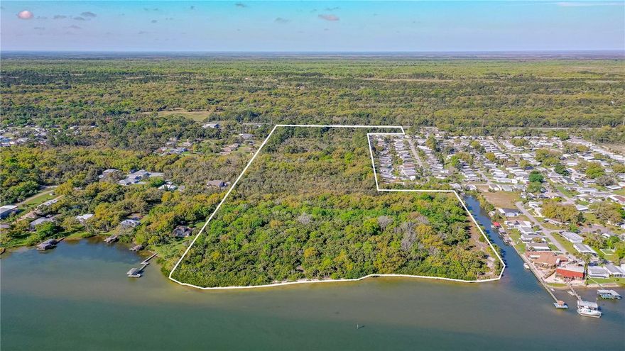 Under contract-accepting backup offers. SHOVEL READY 42-acre waterfront community with complete Development Order issued. This absolutely beautiful parcel has approx. 980 direct Indian River Intracoastal waterway frontage AND another 900 feet of side canal frontage. Fully engineered and permitted for 165 Manufactured Homes with age restriction of 55+ community. Plans includes boat storage and opportunity for a bar, open to the public, on the water. Engineered site plans is provides for 35% open space, of which 6.61 acres of it are in forms of active and passive open space. There is an existing FDOT median cut present at the center of the parcel. Location is within 1 hour of central Florida theme parks, just minutes to the beach and immediately adjacent to the Mosquito Lagoon known for world-class inshore fishing. You are just minutes from I-95. Close to grocery shopping plaza and the multi-purpose trail that transacts the front of the parcel is connected to the regional rails to trails statewide paved trail system. Southeast Volusia area is also known for good shopping and great restaurants.