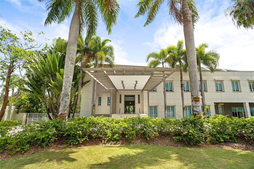 Located in the upscale San Patricio area of Guaynabo, this masterpiece of modern architecture was designed by award-winning architect Carlos Betancourt, epitomizing sophistication and exclusivity. Spanning 10,000 sqft of interior space and nestled on 1.2 acres of meticulously manicured grounds, this home features soaring vaulted ceilings, imported Italian flooring, and custom-designed interiors, including a bespoke kitchen and cabinetry. Expansive living spaces, an executive office, and an entertainment room seamlessly blend elegance and functionality. Inside, seven luxurious bedroom suites—including an opulent master sanctuary—, eight luxurious full bathrooms and two half bathrooms, provide unparalleled comfort, while Valcor high-impact windows and premium finishes enhance the home’s timeless beauty. The grand layout, enriched with exquisite craftsmanship, creates a refined ambiance for both daily living and entertaining. 
Beyond the interiors, the estate extends to a fully air-conditioned outdoor terrace, a heated pool with a gas-heated jacuzzi, and a professional-grade basketball/pickleball court, all designed for both relaxation and recreation. A hidden gem in an elite community, this estate embodies prestige, refinement, and architectural excellence. Beyond the home, San Patricio presents a vibrant lifestyle with proximity to the exclusive Mall of San Juan, San Patricio Plaza, and top-tier restaurants such as Bottles and Ruth’s Chris Steak House. Distinguished private schools, business hubs, and easy access to major highways make this an exceptional location for those seeking luxury, convenience, and a thriving community. Maintenance: $550/mo. Taxes: $5,410/yr.