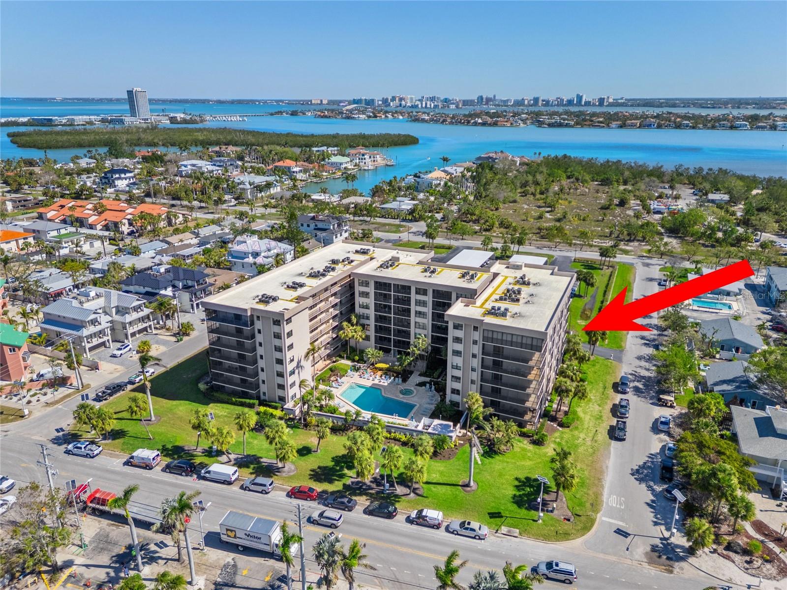 You will fall in love from the moment you enter this stunning updated 5th-floor residence located at the well maintained Lido Towers on Lido Key. With private beach access to the beautiful Lido Beach, this unit has it all! Gorgeous renovated kitchen with wood cabinets, custom pull outs, soft close doors and drawers, granite countertops, the prettiest tiled backsplash, fabulous lighting that adds to the ambiance with under cabinet lighting, indirect lighting, and recessed lighting on adjustable dimmers, ceiling fan, large pantry, and a Culligan filtered water system. Relax on the private wrap around balcony that has wonderful views of the preserve and the downtown city lights. This open plan is light and bright. The luxurious master en-suite boasts a custom walk-in closet, updated vanity with marble counter top, marble shower with glass door, and marble flooring. You will appreciate all of the attention that was given to the details with the engineered wood flooring, plantation shutters through out, impact rated-windows and sliding glass doors, new screen door, plus the HVAC system had a UV light added in 2022. The guest bedroom en-suite has a walk-in custom closet and it's own entrance into the guest bathroom for privacy. Your guest will enjoy the exquisite finishes of the marble top vanity, marble glass enclosed shower, and marble flooring. This unit includes a covered parking space, plenty of guest parking, a storage closet, and community amenities consist of a large heated pool, nice sized hot tub, sauna, grills by the pool, and a club room that has a kitchen and plenty of tables and seating which is perfect for a party. Laundry facilities are located on each floor and includes a laundry sink. Owners are allowed one-month minimum rental twelve times a year. All milestone inspections are complete. Conveniently located to Ted Sparling Park, St. Armand's Circle which has a variety of restaurants and shops, golf courses, and downtown Sarasota.