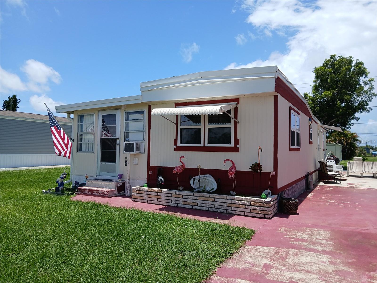 ENGLEWOOD - MANATEE COVE MHP (formerly Holiday Mobile Estates 2nd Add)....and Yes, you own the land, fresh water & salt water canal access, (2) community boat ramps, newly remodeled kitchen with cabinets, 2023 cooktop stove, 2023 new LG Refrigerator, 2023 microwave, Master Bedroom with updated bath & built-in washer and dryer, 2nd bedroom with half bath, laminate flooring, extra 3rd bedroom, water & sewer, 812 sq. ft. of living space, 12x14 rear shed, furniture is negotiable; move-in condition, over 55 community, with optional HOA membership to clubhouse. New roof & new A/C. Seller is offering a 2014 Winnebago Lite 5 for an additional $25,000, if interested.