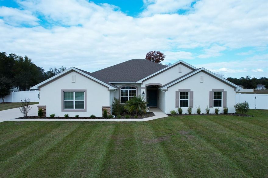 Welcome to Dorchester Estate in NW Ocala. This is a unique Gated Community setting with nature around with elegant Estate Homes.  Property built in 2024 by the well-known builder Adams Homes. This is the Model 3000, Featuring 4 Bedrooms, 3 Full bathrooms and a spacious 3-car garage, Ideally located just minutes from the world-famous World  Equestrian Center. The home features an  Upgraded kitchen  with following,"INTERIOR: Upgraded Kitchen and all bathroom countertops to granite. Features a porcelain barn-style Kitchen sink with a commercial -style, two-function single-handle pull-down faucet and soap dispenser. All kitchen appliances have been upgraded to smart technology, including  all Samsung, Refrigerator, microwave, stove, conventional and air fryer oven, and dishwasher. The Primary  bathroom includes a glass shower door. XL wood-look LVP flooring has been installed in the living room, dining room, hallway and office.  Blinds installed throughout the entire home. "EXTERIOR: 6- foot vinyl perimeter fence enclosing  the full acre, with two 14-foot gates and one 12 foot gate. Half-acre land clearing was completed, along with imported fill material graded to match slope elevation. Bahia grass i has been fully installed on the remaining half acre. The property includes an underground irrigation system with main line, lateral lines, control valves, controller, and zoned sprinkler heads. The Irrigation system covers the Full Property of 1.03 Acres.  Additional upgrades include a smart  front door digital keypad lock. RING doorbell and WYZE 360 motion security camera installed. Gutters throughout the entire exterior and a  Garage door opener installed. Backyard is cleared and ready for outdoor living or pool installation. A very  low HOA and allows RV and boat storage. Located off HWY 40 with quick access to Publix, Amex Grocery and only 15 minutes from Dunnellon at Rainbow Springs where you enjoy with your family outdoor activities like Swimming, Boating, Kayak, Camping and much more for entertainment. Don't miss this amazing opportunity to own a move-in-ready oasis at the sunshine Florida Lifestyle. Schedule for your private tour today.