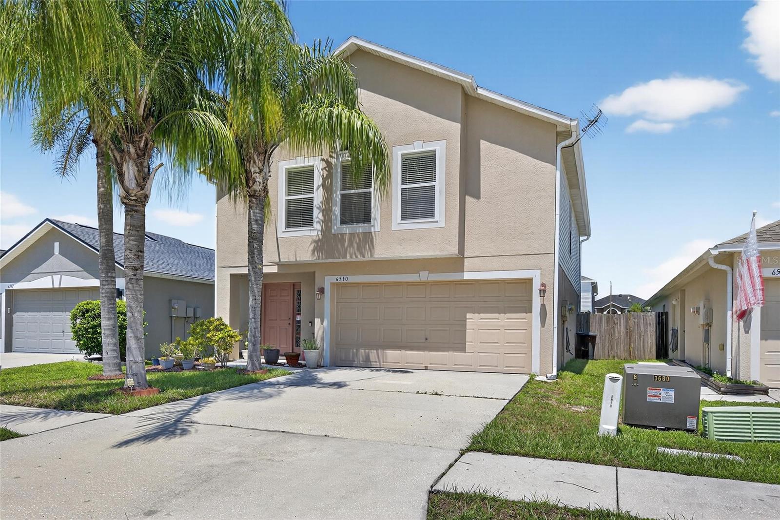 Welcome to 6510 Tabogi Trail in the sought after Chapel Pines community of Wesley Chapel! This beautifully updated 4 bedroom, 2.5 bathroom home offers 1,944 sq. ft. of living space designed for comfort and style. Step inside to find a spacious living room with tile floors, a ceiling fan, and a charming transom window, all open to the upgraded kitchen and dining area. The kitchen shines with oak cabinets, granite countertops, tile backsplash, stainless steel appliances, and a large pantry, plus a functional island with seating and deep drawers perfect for pots and appliances. The primary suite is a true retreat featuring vaulted ceilings, dual closets, and a renovated bathroom with stone counters, rain shower head, and modern finishes. Three additional bedrooms offer carpet, ceiling fans, and plenty of space for family, guests, or an office. Major upgrades include a 2022 roof, 2024 A/C, 2022 water softener, fresh 2025 interior paint, and renovated bathrooms. The smart garage door opener, generator-ready panel, gutters, pest control, and Brinks security system add peace of mind. Outdoor living is a breeze with a fully fenced yard with trees and the greenest of grass. The home also features a spacious garage with storage shelves and foam-insulated panels to keep things cool. Located in a friendly neighborhood with easy access to schools, shopping, and dining, and the Wesley Chapel indoor/outdoor sports complex and playground. This move-in-ready gem is waiting for its next owner. With minimal HOA fees and NO CDD this subdivision offers a well kept community feel with beautiful landscaping plus miles of sidewalks throughout. This is Wesley Chapel living at its best.
