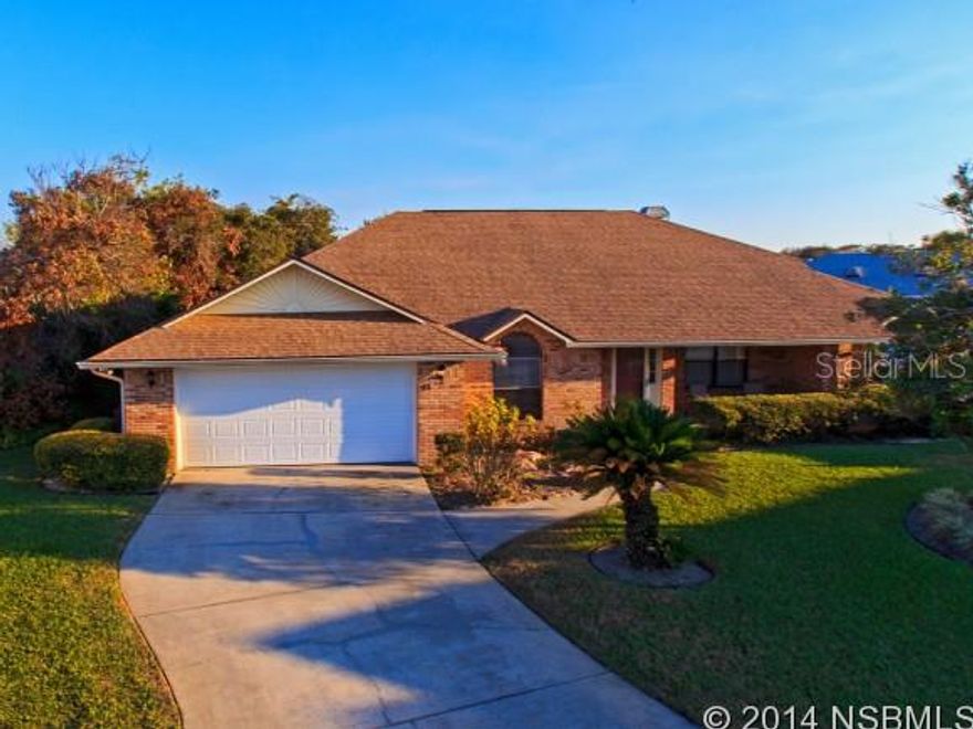 Terrific beachside pool home with great location, desirable split floor plan and modern construction. Light and bright 3 bedroom 2 bath with many desired features including large kitchen, cathedral ceilings, master suite with large walk-in California closet, sliders to covered lanai and pool. Master bath includes double sinks, tiled shower and separate bath. Large kitchen features center island, JENN-AIR range, pantry cupboard and lots of countertops with breakfast bar to casual dining area. A gas fireplace is one of the focal points of the open and airy living room. The other is a wall of glass sliders with transom windows looking out to spacious, covered lanai and screened, solar heated pool. The split plan features two additional bedrooms with a full bath that can be closed off by pocket door. The bath has tiled shower and convenient access from the pool and lanai. Utility room with washer, dryer and laundry sink. Two car garage has extra storage closets. Roof new in 2005 and HVAC in 2009, irrigation well and sprinklers. Desirable cul-de-sac lot with privacy in community of modern homes. Community sewer not septic. Minutes to shopping center, restaurants and more. ;Water: City