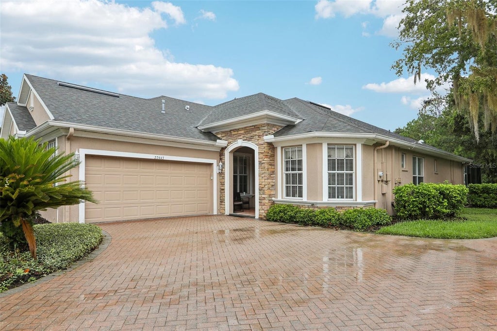 Photo of 27443 Mistflower Drive, Wesley Chapel, FL 33544 (MLS # TB8556365)