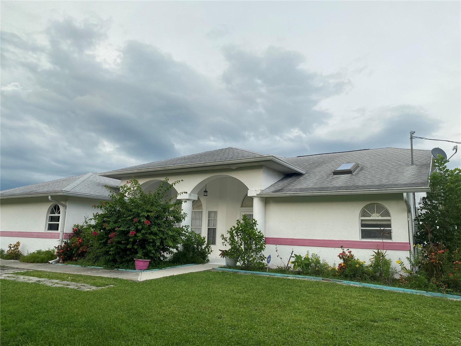 Spacious 3,622 sq. ft. home featuring 4 bedrooms, 3 bathrooms, and an oversized 3-car garage, situated on 2.5 elevated corner lots. Highlights include: Two master suites (ideal for a mother-in-law or guest quarters); Spacious family room with wet bar; Updated kitchen with new stainless steel LG French-door refrigerator, LG dishwasher; Vaulted and cathedral ceilings with decorative plant shelves; Large living and dining rooms; Neutral 18-inch tile throughout living areas and baths;Soaking tub in the primary master suite; Swimming pool; No deed restrictions; Excellent location close to beaches, shopping, golf, hospitals, Home Depot, malls, and Highway 41.