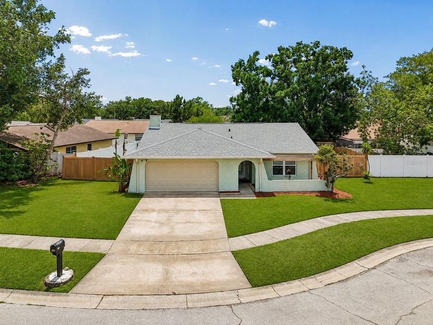 Welcome to 4706 Wandering Way, Tampa, FL 33624  a beautifully updated home located in the highly desirable Carrollwood area, offering the perfect blend of comfort, style, and convenience. Positioned on a quiet cul-de-sac with virtually no through traffic, this 2 bedroom, 2 bathroom home delivers exceptional curb appeal and a peaceful setting surrounded by well-maintained homes. From the moment you arrive, you’ll notice the inviting front entry with a charming trellis and thoughtfully designed landscaping. Inside, the home features a functional and open layout with tile flooring throughout the main living areas, creating a clean, modern feel. The fully updated interior includes fresh paint, newer windows, and upgraded finishes throughout. The spacious family room centers around a cozy wood-burning fireplace, adding warmth and character to the space. The kitchen has been tastefully renovated with granite countertops, newer cabinetry, stainless steel appliances, and a convenient bar seating area that seamlessly connects to the main living space ideal for entertaining or everyday living. Tray ceilings enhance the openness and elevate the overall design. Both bedrooms are generously sized, with updated flooring and modern lighting. The primary suite offers a private en-suite bathroom with a beautifully updated walk-in shower, while the guest bathroom has been fully remodeled with a tub/shower combination. Step outside to enjoy a covered and enclosed patio, perfect for year-round relaxation, overlooking a fully fenced backyard. The yard offers ample space, a wide lot configuration, a large gate for easy access, and a storage shed. The unique wood-look privacy fence adds both style and durability. Additional highlights include a newer roof, updated systems, and a move-in ready condition that makes this home ideal for homeowners or investors alike. Located just minutes from shopping, dining, parks, and major roadways, this Carrollwood gem offers convenience without sacrificing tranquility.
(ROOF-2026)(A/C-2021)(W/H-2021)(FENCE-2020)(CUSTOM ALUMINUM HURRICANE PANELS-2020)