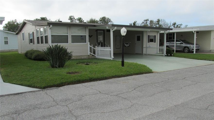 This well-maintained home is a spacious 1000 SF home with plenty of room for storage. An additional storage area behind the home may be able to be used for storage or for working on your hobbies. The side-by-side parking is especially convenient for two vehicles. The carport roof was replaced at the same time as the shingle roof.  Window replacement was completed in 2019, new roof installed in April 2023. Kitchen cupboards are original but have been refreshed with new paint. The plumbing has also been updated, no gray pipe as well. New anchors and vapor barrier was installed, 2023.The A/C that was replaced in 2017. This furnished home in a lovely community is a must-see gem. With amenities that includes inside and outside activities to keep you active and social with all your friends throughout the community. We have a very challenging 18-hole executive golf course along with a practice net.   Fishing and boating are another option for those that are outdoors enthusiasts along with outside Shuffleboard courts. Our billiard room offers two billiards tables and a shuffleboard table. For those that like to hold a book to read, our library offers many books for your enjoyment. All this and many parties, dances, and entertainment. If you enjoy swimming, we have a beautiful pool that has the ability to be heated and cooled.
Please come take a tour and see this home and beautiful community.