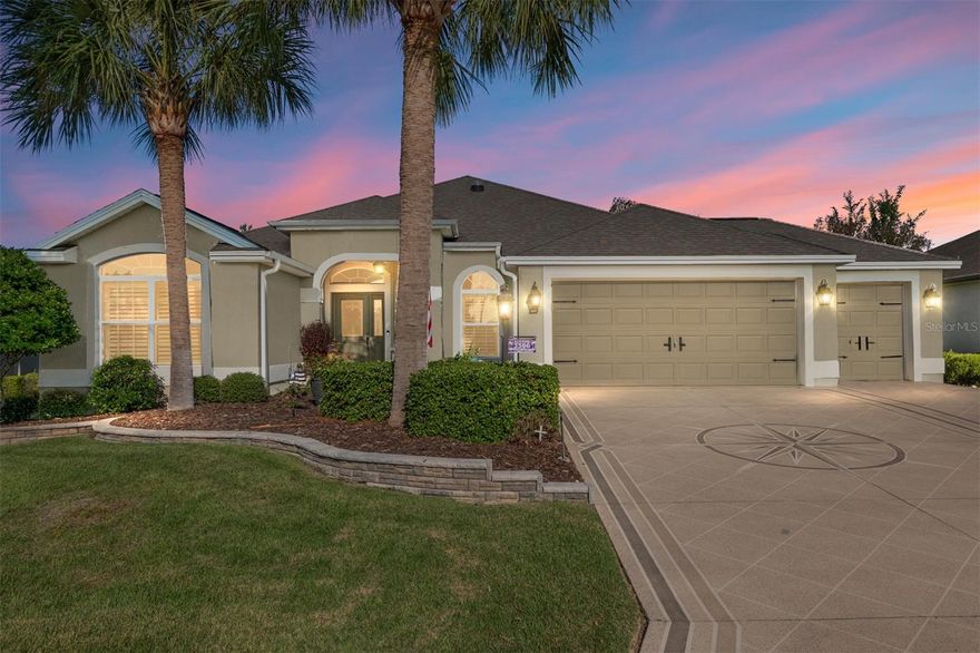 Only a 5 minute ride to Brownwood Town Square, this stretched Gardenia designer model home in the Village of Hillsborough s sure to please.  Immediately, you will notice the manicured landscaping with stone wall borders, the palm trees and patterned drive and walkway. As you walk through this home view the crown molding and the high ceilings in every room. Beautiful Hickory engineered flooring in found in the main living area and in all the bedrooms. The spacious functional kitchen has maple wood cabinets, granite counters, newer stainless appliances, a custom-built moveable center island, and wood paneling on the bar area. Enjoy your morning coffee in the light-filled attached eating area.  Moving to the primary suite, the bedroom with its high ceilings, crown molding and engineering hardwood flooring feels both spacious and serene.  The attached primary bath is designed for both comfort and maximum usability.  It has separate vanities, both with rectangular sinks and granite counters, lots of storage, a private toilet room, and a large Roman shower.  Both guest rooms have volume ceilings, crown molding, closets, and engineered Hickory hardwood floors.  One bedroom, now used as a craft room, also features a pull-down Murphy style bed to accommodate those extra guests. The oversized two car plus golf cart garage is filled with many custom-built storage cabinets.  There are stairs to the attic, and once in the attic notice the extra flooring and the solar attic fan. Moving to the back of the home, the stretched lanai with patterned floor, has the extra space needed for relaxing with friends and family and enjoying the outdoors. This backyard offers privacy, a low maintenance defined stone walkway, and gorgeous landscaping with up-lighting. The stone patio, another private place for outdoor relaxation, features a retractable electric awning to provide shade when needed.  A rejuvenating hot tub is tucked away in another private area of the yard. This home offers a convenient Villages location close to golf courses, stores, restaurants and entertainment. It has been loving updated and maintained, and offers many special features, all ready for a new owner. Please stop by to see if this could be your next Villages home.