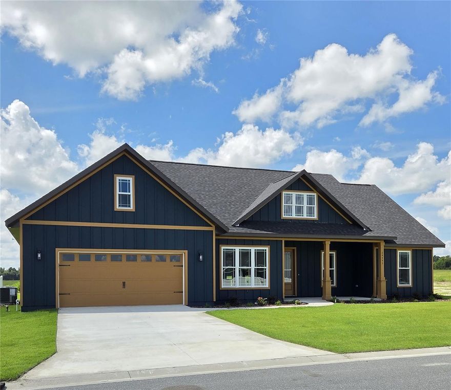 Complete and ready to move in! This beautifully finished 3-bedroom, 2-bath Norfleet Home is loaded with upgrades and located in the highly sought-after CountryWay Town Square community—offering small-town ambience with every modern convenience close by.

Built by one of the area’s premier builders, this home features an upgraded Board & Batten front exterior on a premium private lot. The open, efficient floor plan includes engineered wood flooring throughout, 9’ ceilings, and abundant storage. The spacious living and dining areas flow seamlessly into the gourmet kitchen, featuring a 10-foot island, upgraded cabinetry, farm sink, walk-in pantry, and stainless steel appliances (dishwasher, microwave, oven/range).

The primary suite is thoughtfully designed with direct access from the walk-in closet to the laundry room, a beautifully upgraded master bath, and elegant LED lighting throughout the home. Additional highlights include a 2-car garage, large front and back porches, front sprinkler system, and a low-maintenance yard. HOA maintains the front lawn, with dues of $250 quarterly ($1,000/year).

Residents of CountryWay Town Square enjoy top-tier community amenities including a pool, volleyball, Stonehouse Grill, Tortillas Tex-Mex, BIM Health Facility, and regular live concerts and events on the Town Square.

Prime location—just 2.5 miles from downtown Newberry’s restaurants, shopping, pharmacy, and sports facilities. Schools from preschool through high school are within 1 mile. Enjoy nearby natural springs and state parks 15–20 miles away. Convenient access (within ½ mile) to SR 26, 235, and 41/27 allows easy travel to Gainesville, Alachua, High Springs, and Archer.

You’ll be pleasantly surprised by the affordable Newberry utilities and low insurance costs that come with this brand-new, energy-efficient home!