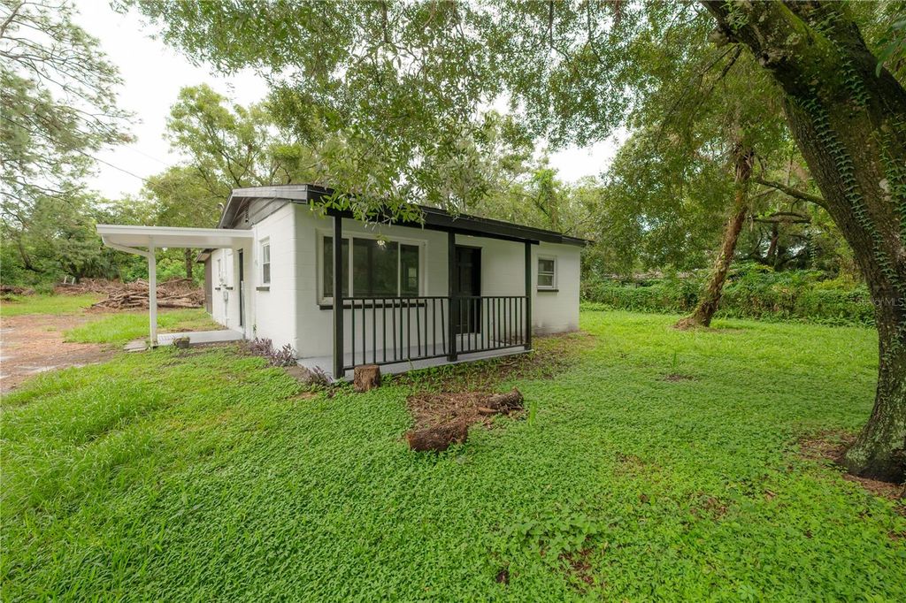 Photo of 10411 N Woodmere Road, Tampa, FL 33617 (MLS # TB8477373)