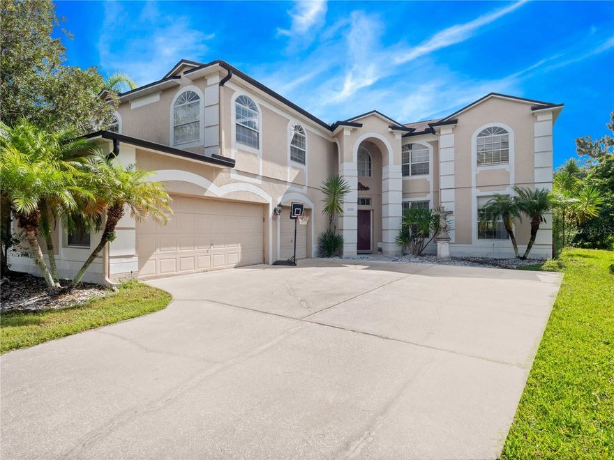 Absolutely breathtaking MASSIVE FIVE BEDROOM PLUS BONUS POOL ESTATE located in the highly desirable GUARD GATED GOLF community of Stoneybrook! Open the impressive double doors to a soaring two story foyer with tile gracefully flowing throughout the entire main floor! Large formal living and dining spaces with tons of natural light throughout! NEWER ROOF (2018) AND NEWER HVAC (2019) WOW! The chef inspired kitchens comes fully equipped with rich dark wood cabinetry, GRANITE counter-tops, stainless steel appliances with a GAS range, and a great size island! The kitchen opens into the nook and the great size family room with a FIREPLACE! There is also a bedroom and full bathroom downstairs that could make for an ideal MOTHER-IN-LAW SUITE! Upstairs the GINORMOUS MASTER REATREAT features a sitting room and balcony, OVERLOOKING the GOLF COURSE AND POND! All guest rooms are ample size and feature tile flooring. The OVERSIZED BONUS ROOM features a wet bar that gives you endless possibilities! The THREE CAR GARAGE gives you plenty of room for your toys! Embark out the FOUR sets of French doors and into your own tropical oasis! The Roman inspired pillars line the sparkling blue pool with rock waterfalls and a jetted heated spa all under a screened enclosure! Come visit the magnificent Stoneybrook community, featuring a state-of-the-art clubhouse with fitness center, resort-style pools, playground, ball fields, tennis & basketball courts, walking trails, lush nature & golf vistas. Conveniently close to A-rated local schools, UCF, Research Parkway, shopping and dining at the popular Waterford Lakes Village and Avalon Park Town Center, & easy highway access via the 528, 408, and 417. This home has too many features to list!! It is the complete package, make an appointment today!!