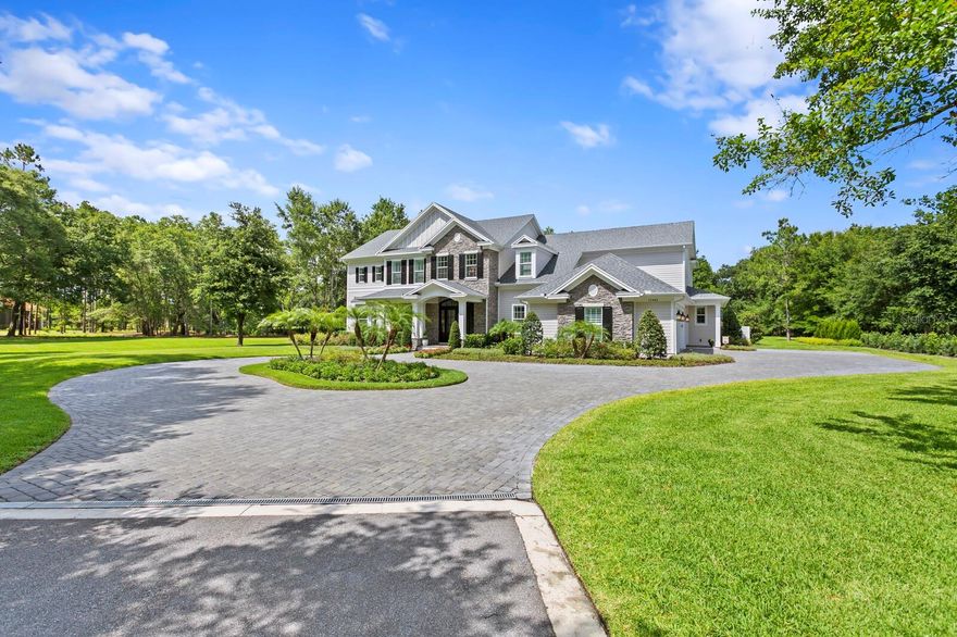 MASSIVE $300k price drop.  Priced significantly under comps! Back on market due to buyers funding issue and failure to close. Welcome to this exquisite custom-built home in the beautiful, private, gated community of Oak Reserve. Built by the renowned Bayfair Custom Homes in 2020, this 6,947 SF home is nestled on a breathtaking 1.4-acre lakefront homesite just 11 miles north of Downtown Tampa. The estate-style residence boasts five spacious bedrooms, five full bathrooms, two half bathrooms, a study, a game room, a media room, and two laundry rooms for your convenience. A grand double-height foyer with a cantilevered staircase welcomes you into the home, leading you back into an impressive great room - featuring soaring coffered ceilings, expansive transom windows for abundant natural light, custom built-ins, and a cozy gas fireplace. A large custom kitchen equipped with Wolf & SubZero appliances and gorgeous custom cabinetry overlooks the stunning pool area. For formal occasions, a separate dining room with a butler's pantry awaits. The first floor also offers a game room with a full bathroom and wet bar, a fully equipped media room for entertainment, and a gracious guest suite. Additionally, you'll find a half bathroom, laundry room, and a large mudroom area to complete the main level. On the second floor, discover four more sizable bedrooms, including the elegant owner's suite - complete with a charming covered porch, two expansive walk-in closets, a dressing room, a large primary bathroom featuring two vanities, a spacious walk-in shower, two water closets, and a relaxing bathtub. Two bedrooms share a jack & jill bathroom, and another bedroom offers an ensuite bathroom. The second floor also houses the primary laundry room and a large storage room. The grand staircase in the foyer is complemented by a back staircase off the mudroom. Full walk-up attic with flooring, storage & insulation. The outdoor space is a true oasis, featuring a resort-like pool and spa with gas and electric heaters, fire bowls, water features, and travertine decking. The summer kitchen invites al fresco dining, and the landscaped yard with new smart home-enabled irrigation adds to the beauty. Exceptional features and upgrades include a dock, fish feeder, fire pit, landscape lighting, a whole house Generac generator, spray foam insulation, Denco water softeners system, extensive smart home automation technology, and a multitude of speakers and cameras throughout the home, and pool area. Don't miss out on the chance to own this exceptional home - where luxury, functionality, and tranquility converge in perfect harmony. ***The adjacent lot (lot 8) (MLS # T3451489) is owned by this homeowner and is also for sale should the buyer want additional land. Total lot size would be 2.37 acres with the additional adjoining lot which is a one-acre, buildable waterfront homesite, presenting an exceptional opportunity.