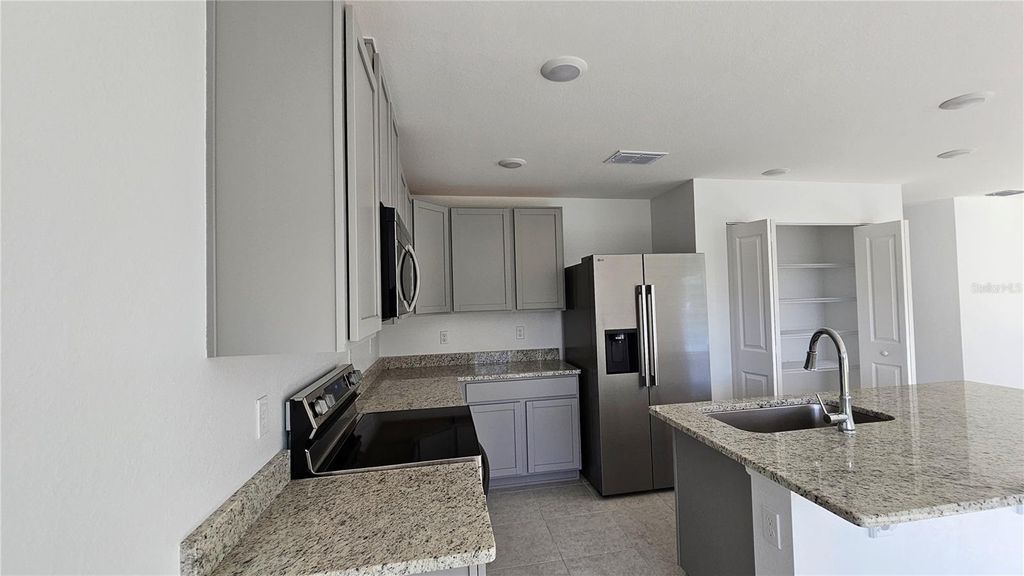 Photo of 3203 6th Street W, Lehigh Acres, FL 33971 (MLS # O6370023)