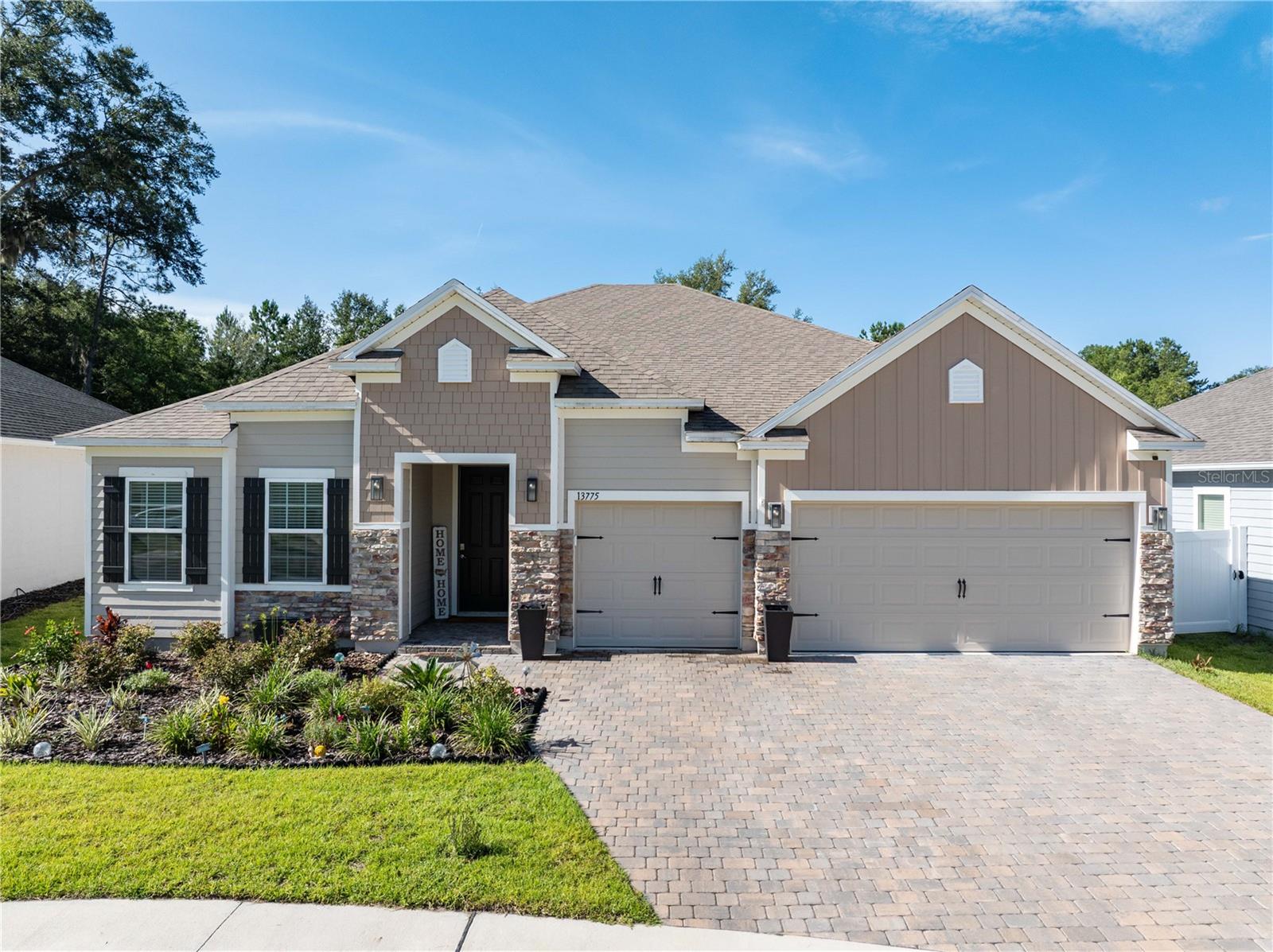 Modern Elegance Meets Everyday Comfort in Sought-After Tara Estates!
Welcome to the Venice—a beautifully designed 4-bedroom, 3-bath home offering over 2,600 sq ft of spacious, single-story living in one of Gainesville’s most desirable neighborhoods.
Step inside to soaring ceilings, oversized windows, and an open-concept layout perfect for entertaining or quiet evenings in. The heart of the home is the chef-inspired kitchen featuring a massive island, walk-in pantry, and seamless flow into the living and dining areas. Whether you're hosting friends or feeding the family, this space flexes to fit your life.
The thoughtfully split floor plan includes a dreamy owner’s suite tucked privately to the rear, complete with a spa-like bath and direct access to a sunlit breakfast nook—perfect for morning coffee or a good book. Three additional oversized bedrooms and a third full bath offer comfort and space for guests, kids, or a dedicated office setup or in-law suite.
Out back, enjoy peaceful mornings or alfresco evenings on the covered lanai, with no rear neighbors and a tranquil natural backdrop. The 3-car garage provides ample room for vehicles, storage, or even a golf cart.
Tara Estates offers sidewalks throughout the community—perfect for morning strolls, evening walks, or a casual cruise to the nearby Tioga Town Center. Built with quality concrete block construction and energy efficiency in mind, this home blends function and style—just minutes from top-tier schools, dining, and shopping.
If you're looking for comfort, space, and community—all wrapped in one—you’ve just found your next move.