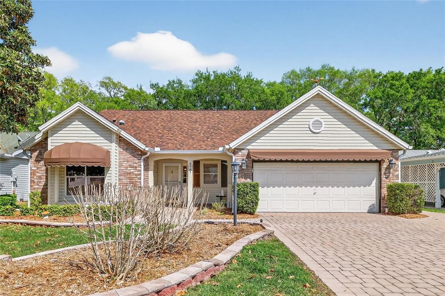 This beautiful 3/2 San Marino model is located on a private Cul-de Sac with the rear of the house overlooking a treed lot and a  water canal that flows into the Mira Mesa Golf Course pond. The entrance of the home features a  Brick front framed by Awnings, and a Brick paved driveway with and added  Brick walkway leading to lovely peaceful picturesque backyard. The large garage has a remote screen, lots of cabinets, countertop with a sink ,an acrylic painted floor, and pull down attic stairs to an above storage area.
Entering the main entrance of the home reveals decorative columns with shelves, tile flooring and crown moldings. showcasing an Open floor plan with 10Ft. ceilings .Enjoy the large kitchen with stainless steel appliances next to a dining/ family room  combo which leads to an enclosed lanai overlooking the serene yard.
All interior fan lights have remote controls. A new roof was installed in 2023 which has lightning rods for extra protection. All gutters on home have gutter guards. Home is partially furnished and a 2008 Yamaha Gas 4 seat golf cart is included with sale of home. Come enjoy The Villages and all  the amenities this beautiful community has to offer. Also No Bond !!! 
Schedule an appointment today to view this lovely home.